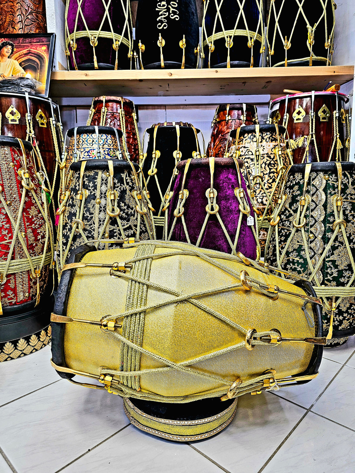 Radiant Rhythms: Golden Sparkly Wrapped Red Sheesham Dholak with Black Skins, Thin-Rimmed Treble Skin, and Golden Accents - *Slightly Imperfect Wrap