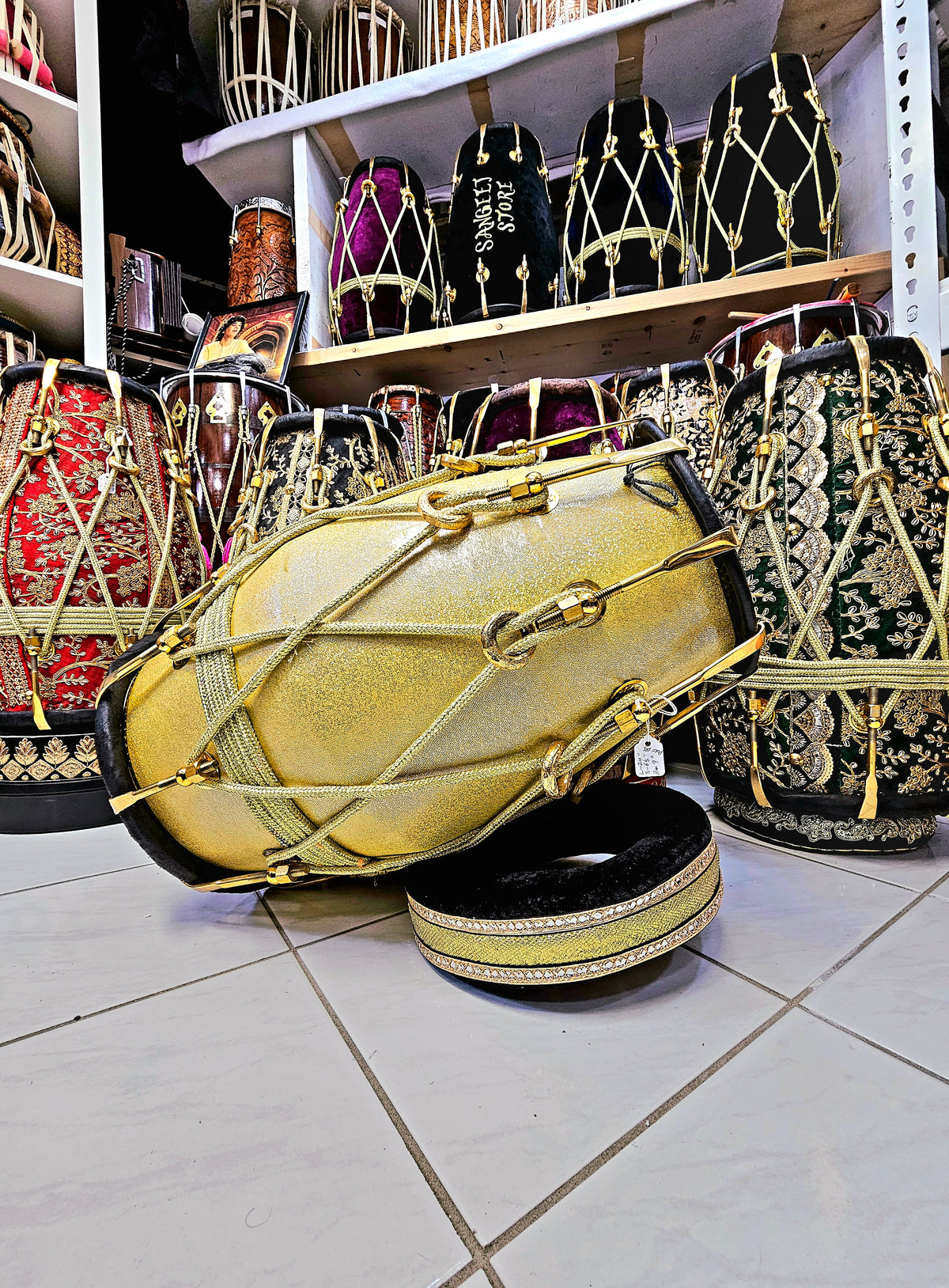 Radiant Rhythms: Golden Sparkly Wrapped Red Sheesham Dholak with Black Skins, Thin-Rimmed Treble Skin, and Golden Accents - *Slightly Imperfect Wrap