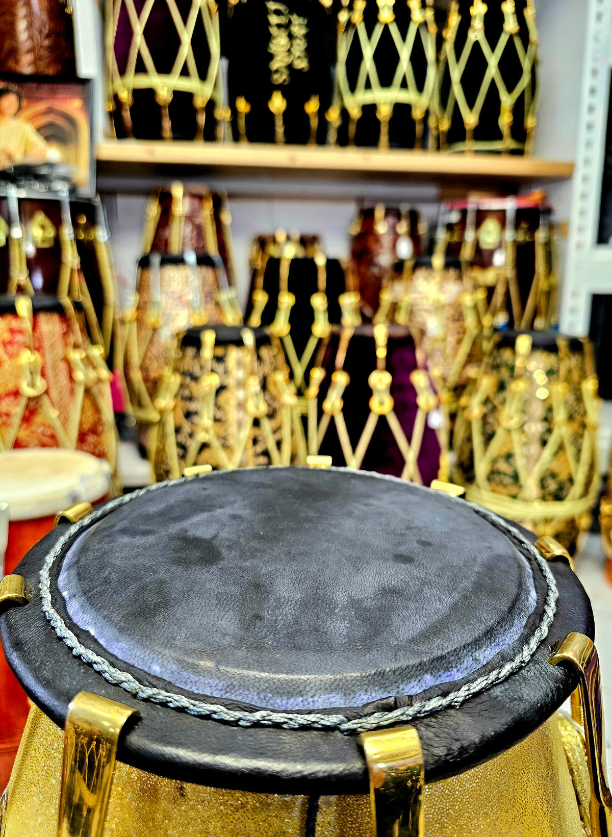 Radiant Rhythms: Golden Sparkly Wrapped Red Sheesham Dholak with Black Skins, Thin-Rimmed Treble Skin, and Golden Accents - *Slightly Imperfect Wrap