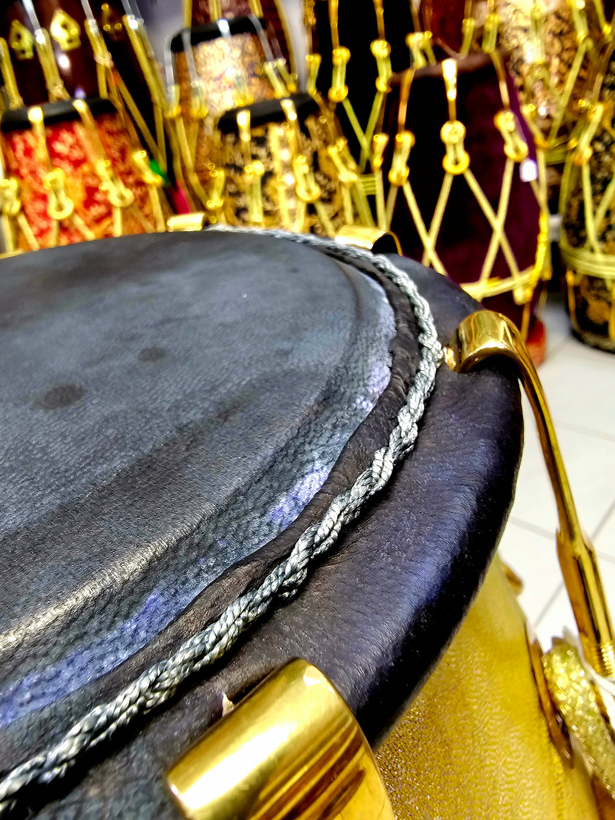 Radiant Rhythms: Golden Sparkly Wrapped Red Sheesham Dholak with Black Skins, Thin-Rimmed Treble Skin, and Golden Accents - *Slightly Imperfect Wrap