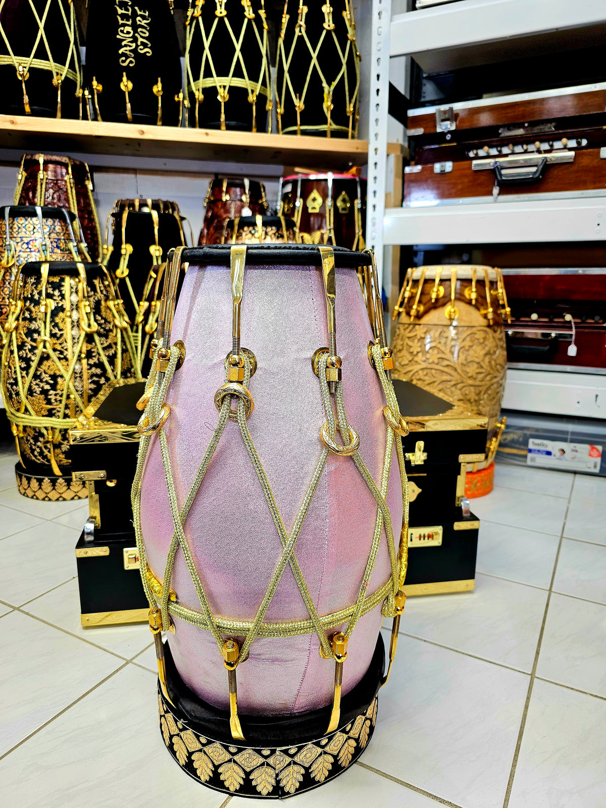 Enchanting Blush Sparkle: Red Sheesham Dholak in Sparkly Pink Wrap, Black Skins, Golden Brass Accents, and Intricate Golden Ropes