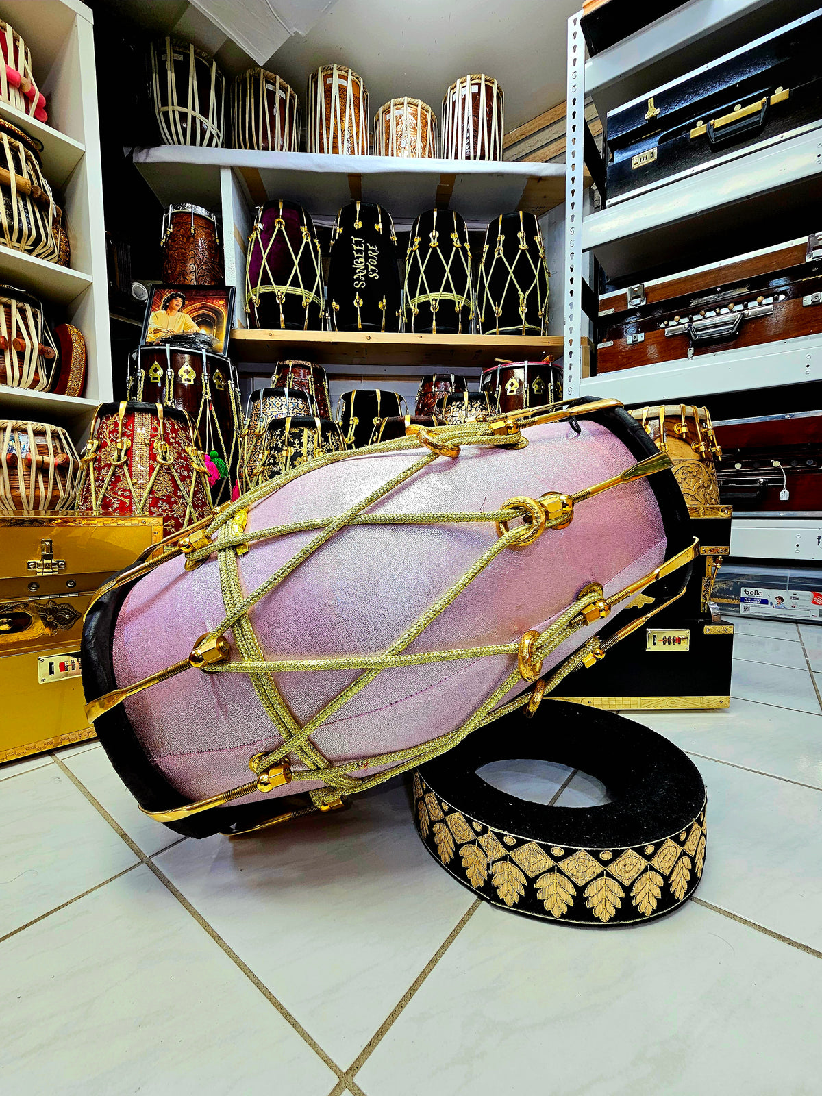 Enchanting Blush Sparkle: Red Sheesham Dholak in Sparkly Pink Wrap, Black Skins, Golden Brass Accents, and Intricate Golden Ropes