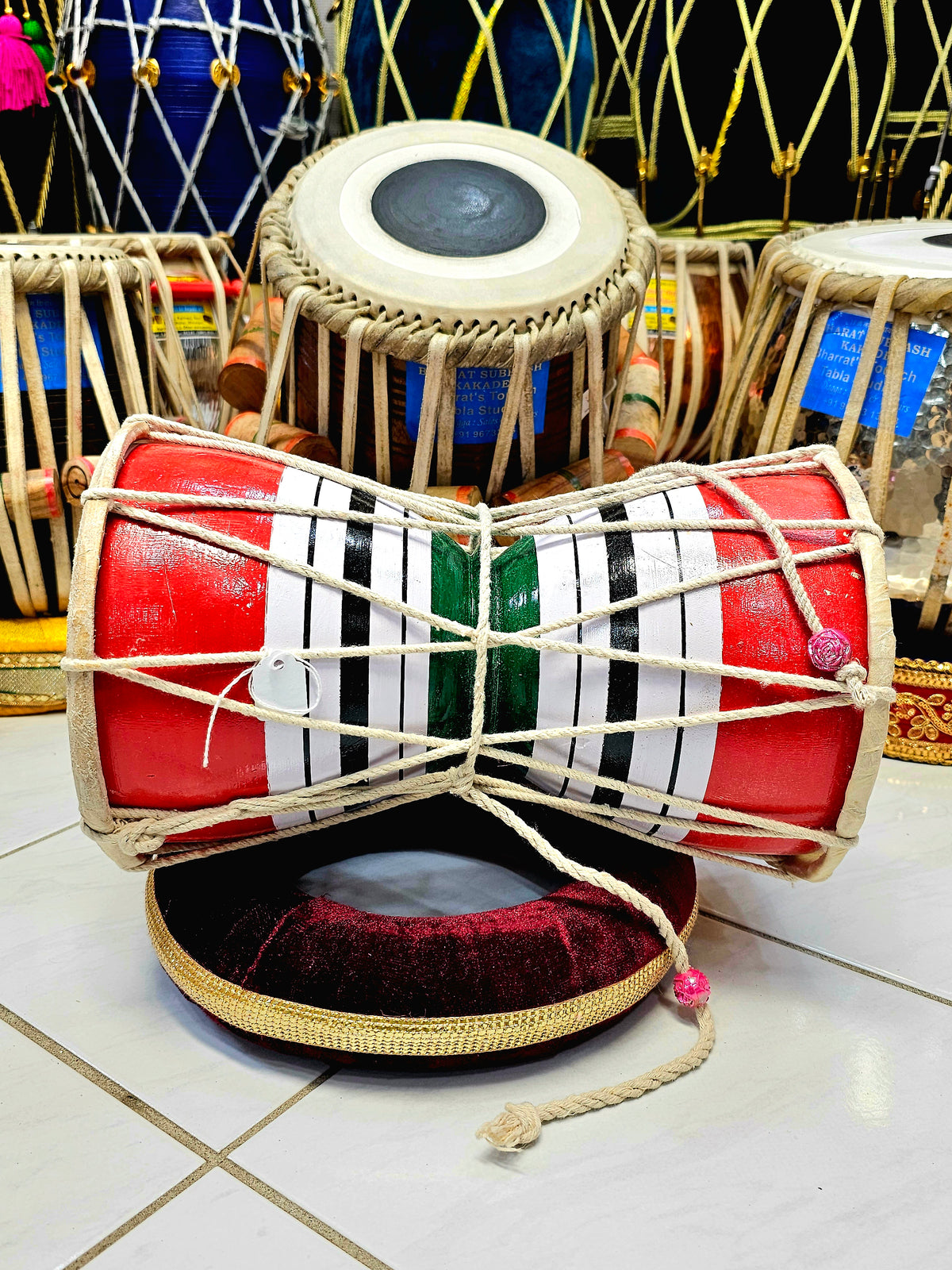 Trinity Rhythm Damru: Red, White, Black with Vibrant Green Core - Sangeet Store