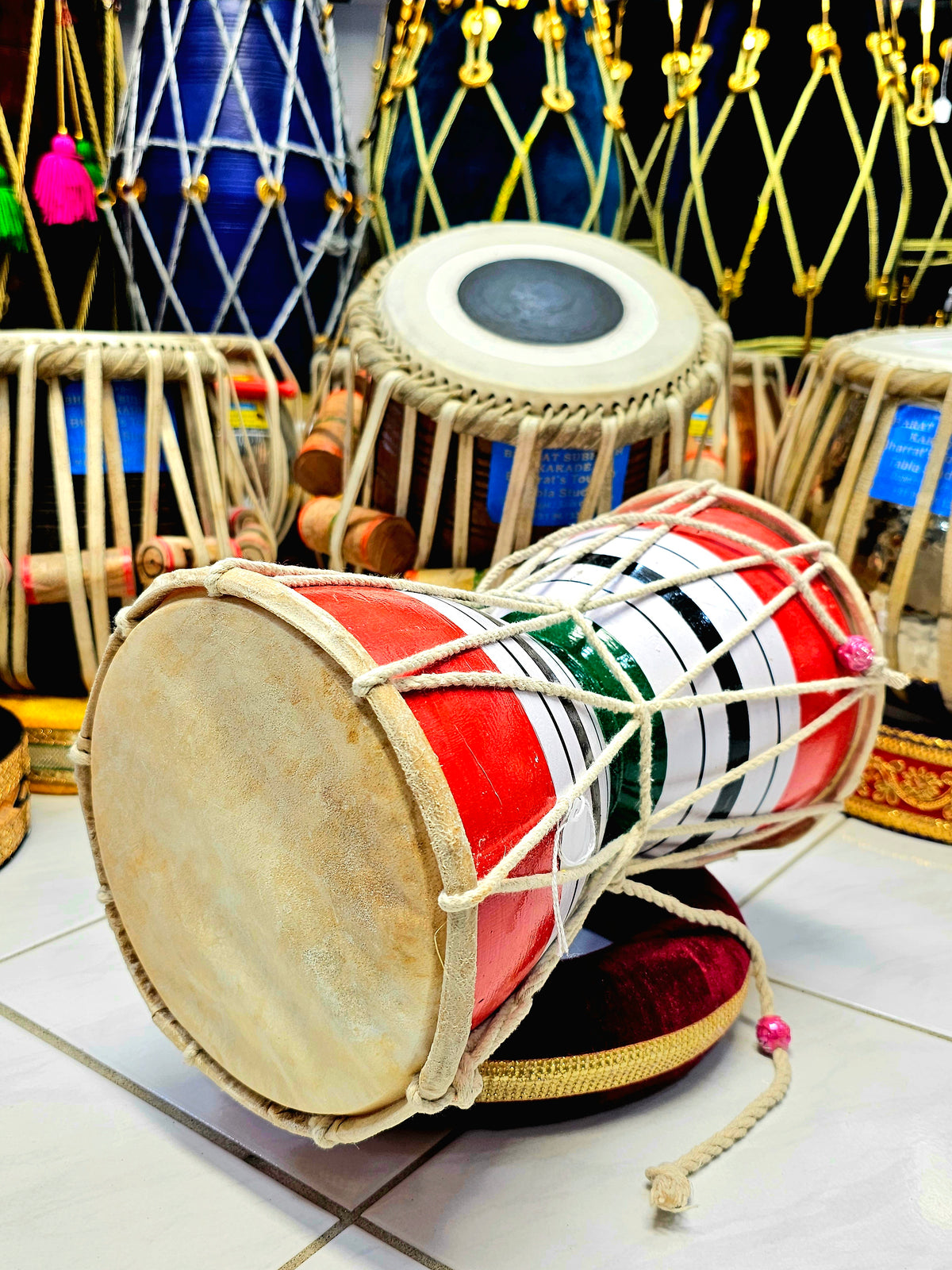 Trinity Rhythm Damru: Red, White, Black with Vibrant Green Core - Sangeet Store