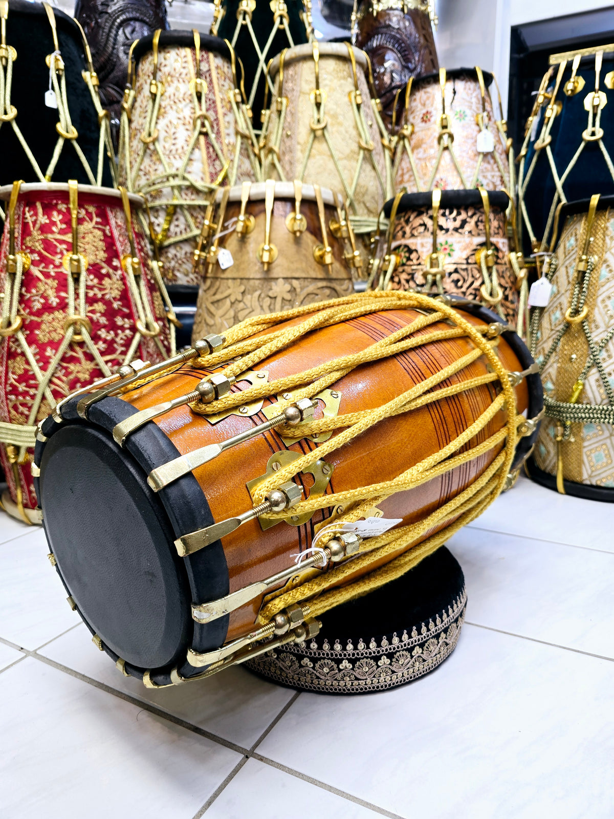Golden Echo: Traditional Red Sheesham Professional Double Bolted Dholak with Golden Coated Brass Bolts, Black Skins, and Yellow Ropes Design