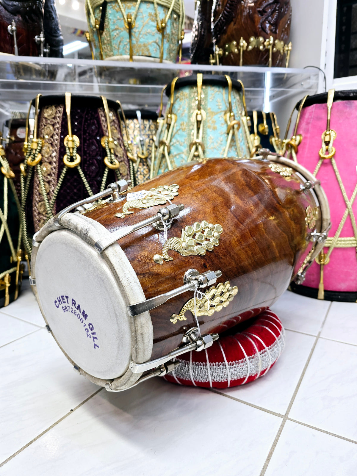 Mayurdhwani™ by Chetram Gill | Red Sheesham Dholak, 16 lbs with Gloss Finish, Golden Peacock Accent & Chrome Bolts