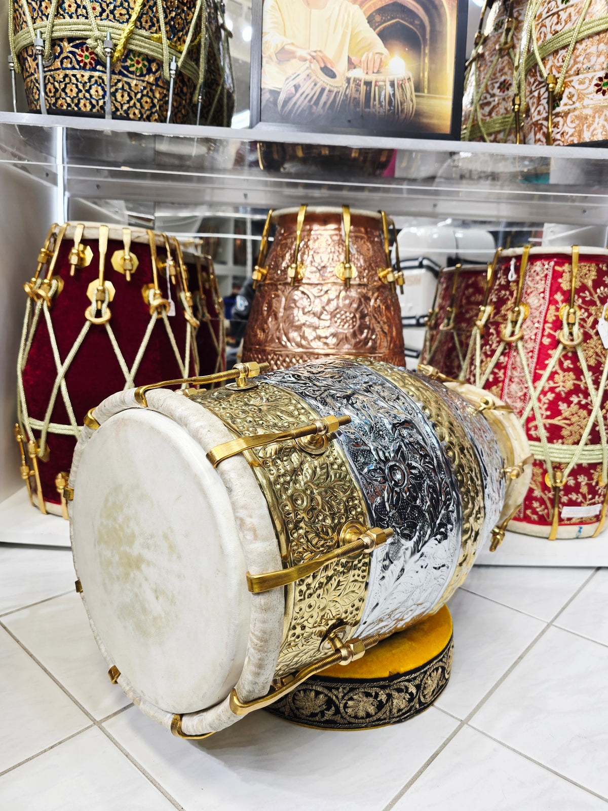 Udhyam's Package: SvarNāratna – The Encarved 15.6 LBS Copper Crown Dholak + Transparent Ghattas + Dholak Bags + Masala - Sangeet Store