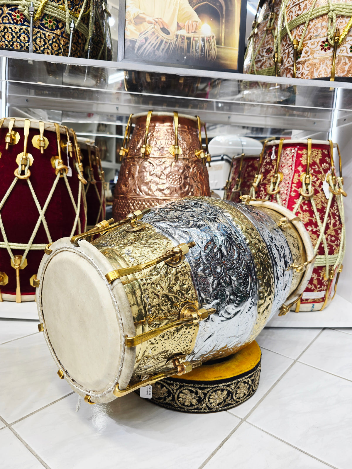 Udhyam's Package: SvarNāratna – The Encarved 15.6 LBS Copper Crown Dholak + Transparent Ghattas + Dholak Bags + Masala - Sangeet Store