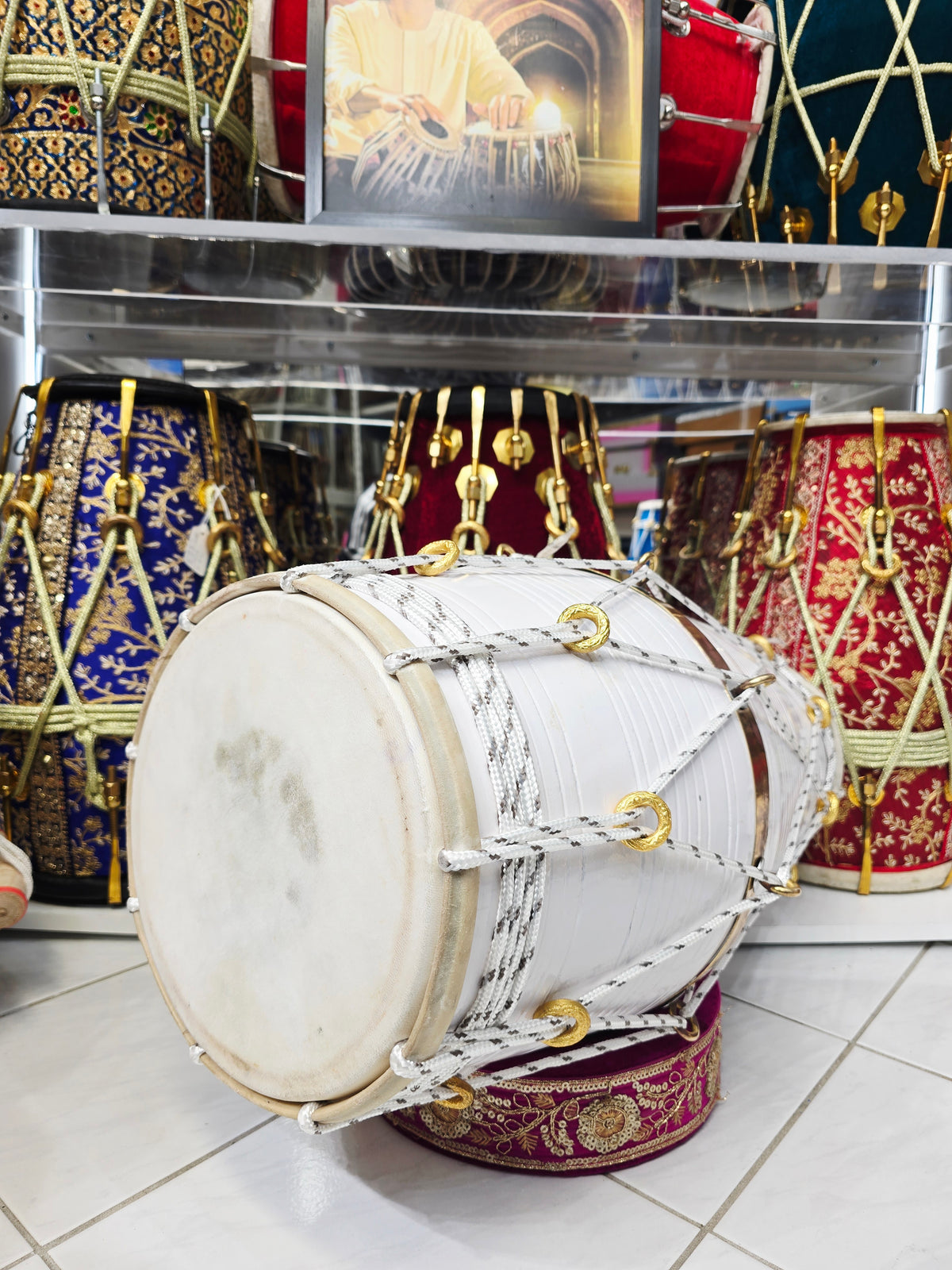 Ivory Current – West Indian Dholak
22.5″ Length | 14.4 lbs Red Sheesham | Exceptional Tone • Minor Cosmetic Blemishes