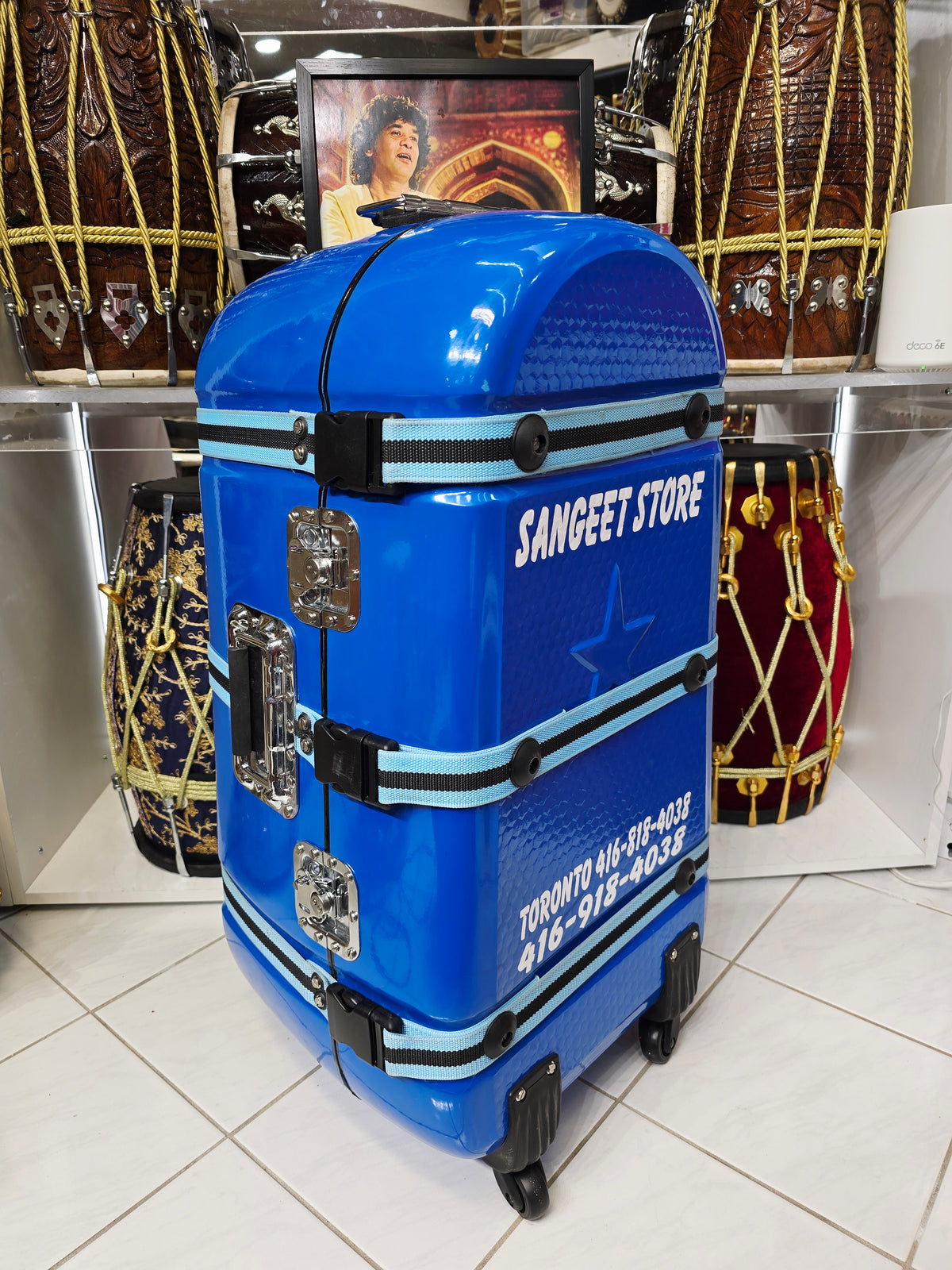 Azura Drift — Glossy Blue Tabla Travel Case · 360° Spinner Wheels · Dual Handles · Fixed Reinforcement Bands · Minor Cosmetic Blemishes (g)