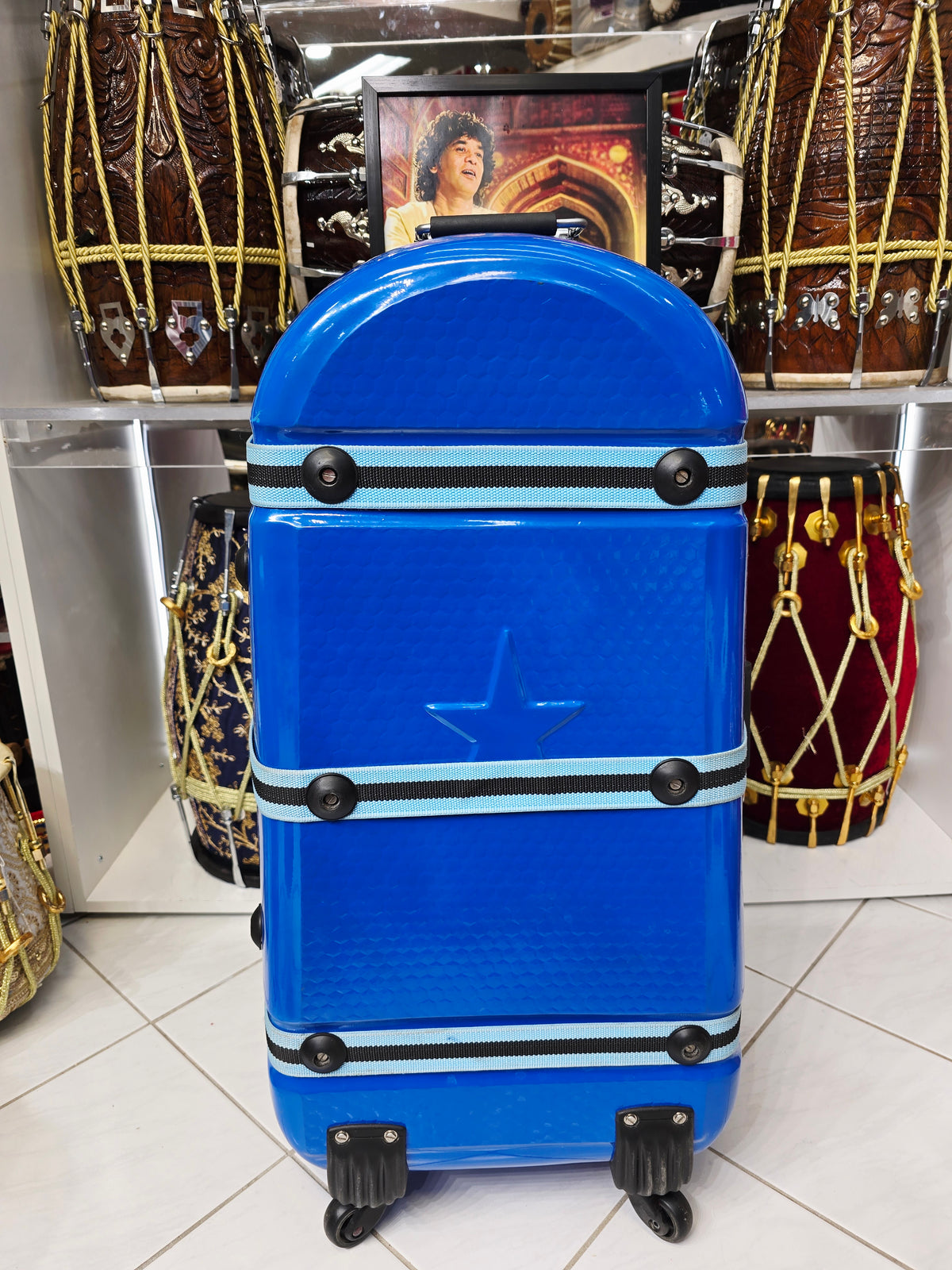 Azura Drift — Glossy Blue Tabla Travel Case · 360° Spinner Wheels · Dual Handles · Fixed Reinforcement Bands · Minor Cosmetic Blemishes (g)