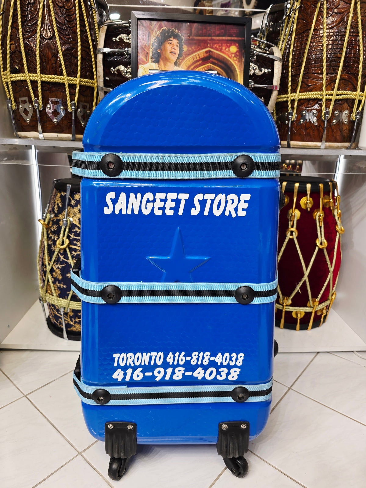 Azura Drift — Glossy Blue Tabla Travel Case · 360° Spinner Wheels · Dual Handles · Fixed Reinforcement Bands · Minor Cosmetic Blemishes (g)