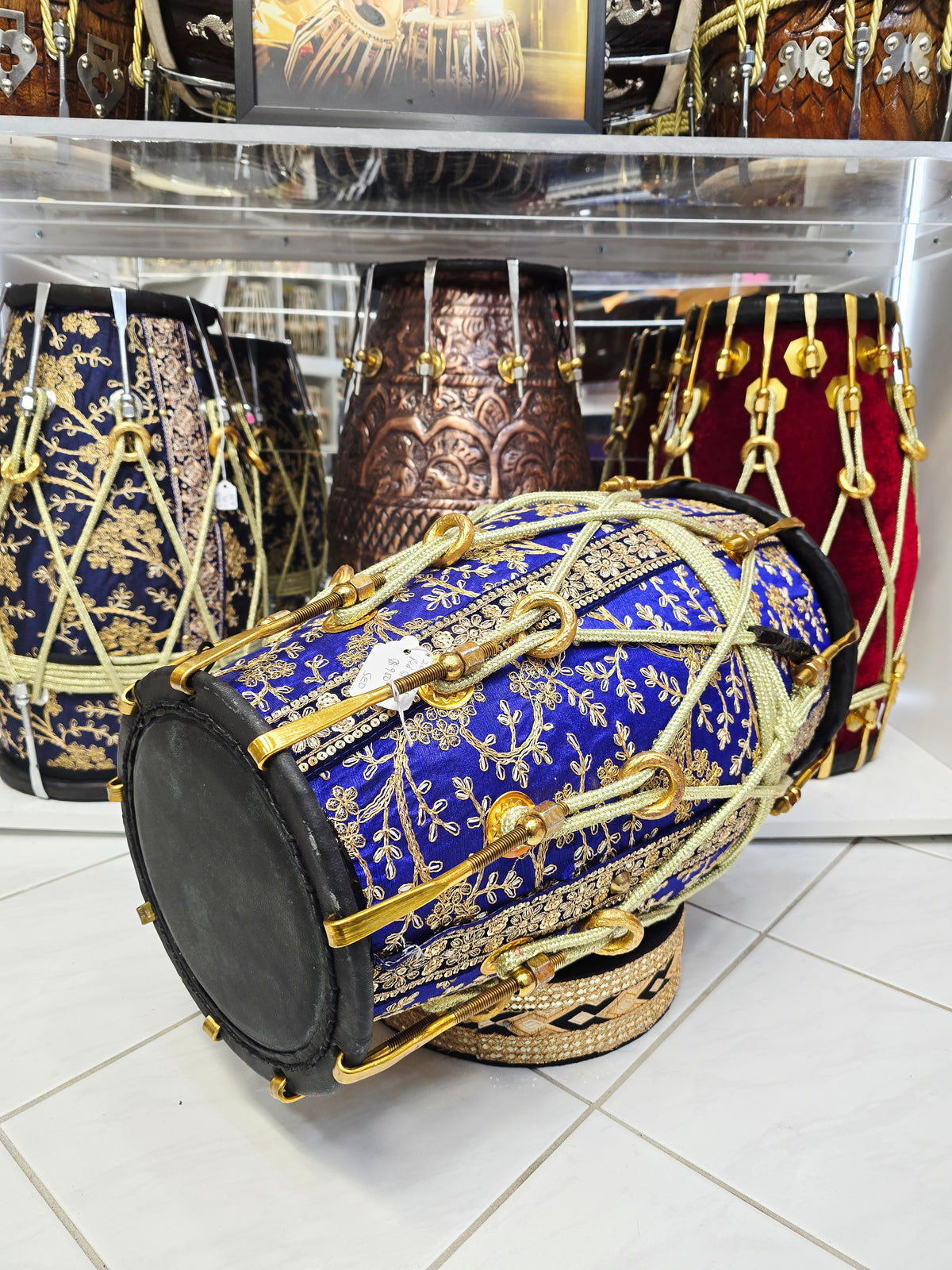 Royal Heritage: Blue and Gold Sherwani Wrapped Red Sheesham Dholak with Reverse Syaahi Thin Rimmed Skin and Black Skins *Minor Cosmetic Defects *Exceptional Tone