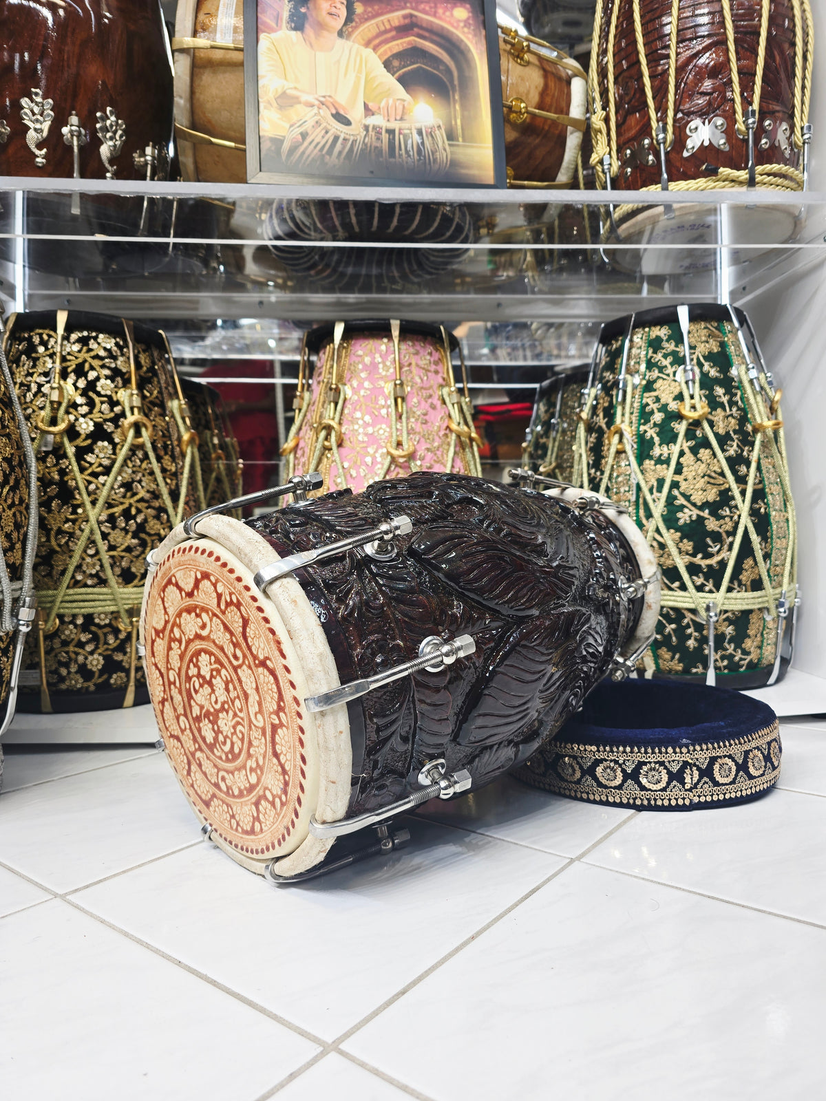 Rajshree Heritage Black Sheesham Dholak by Maa Ambika | Intricately Hand Carved Glossy Shell with Green Undercoating with Mehendi Designed Skins