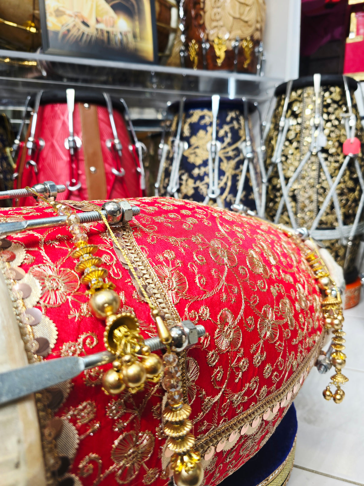 Gulabi Shringar – Royal Scarlet & Gold Floral Sherwani-Wrapped Designer Mehendi Night Dholak with Decorative Golden Ornaments (R1)