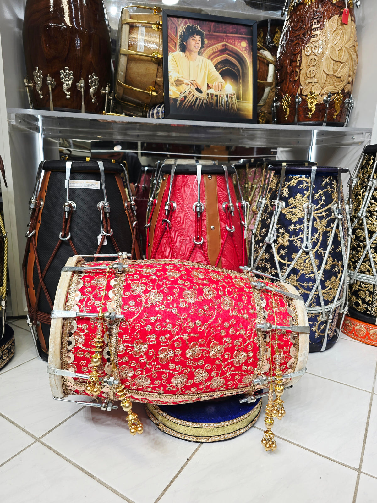 Rang Mahal – Royal Scarlet & Gold Floral Sherwani-Wrapped Designer Mehendi Night Dholak with Decorative Golden Ornaments