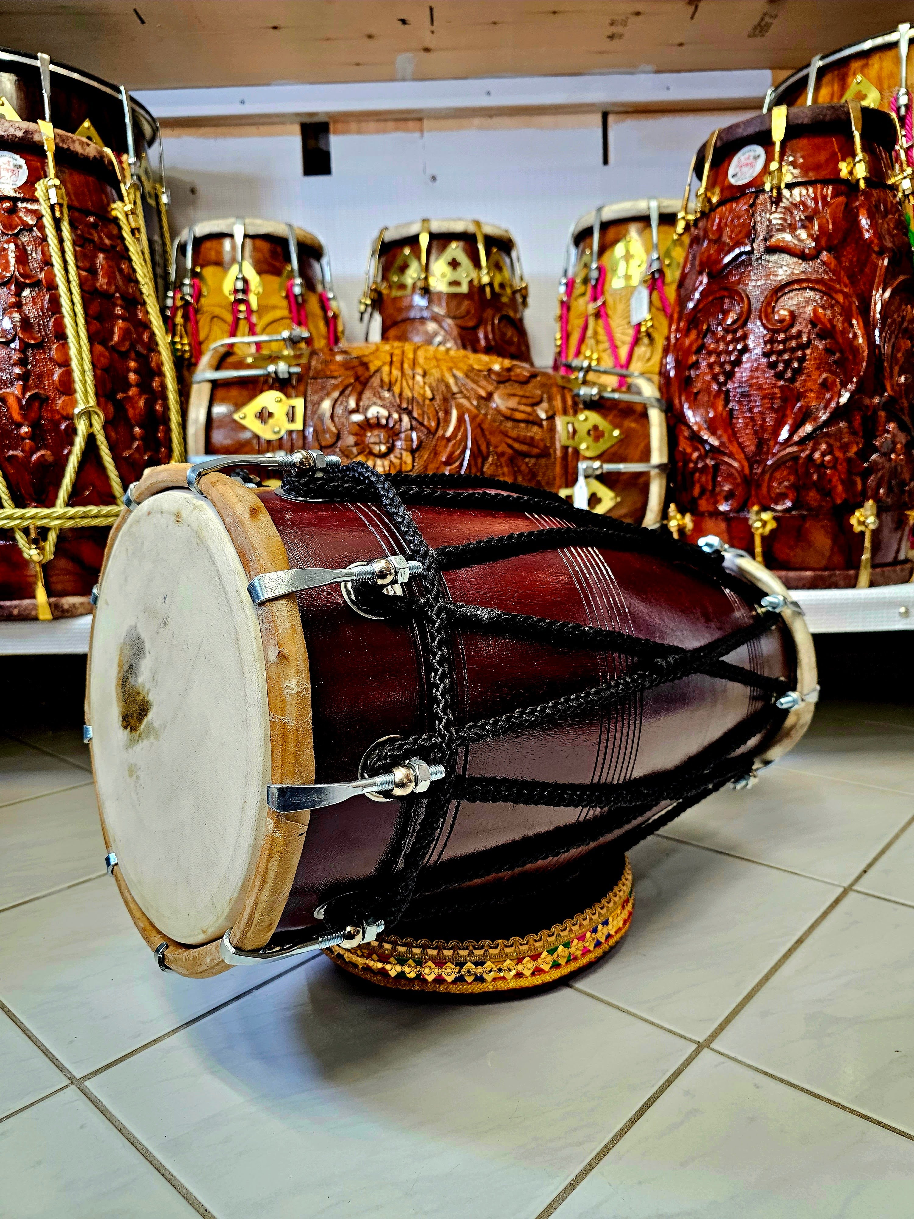 The Burgundy Premier Pro Dholak - A Professional Mango Wood Dholak with Black Ropes and Chrome Bolts!