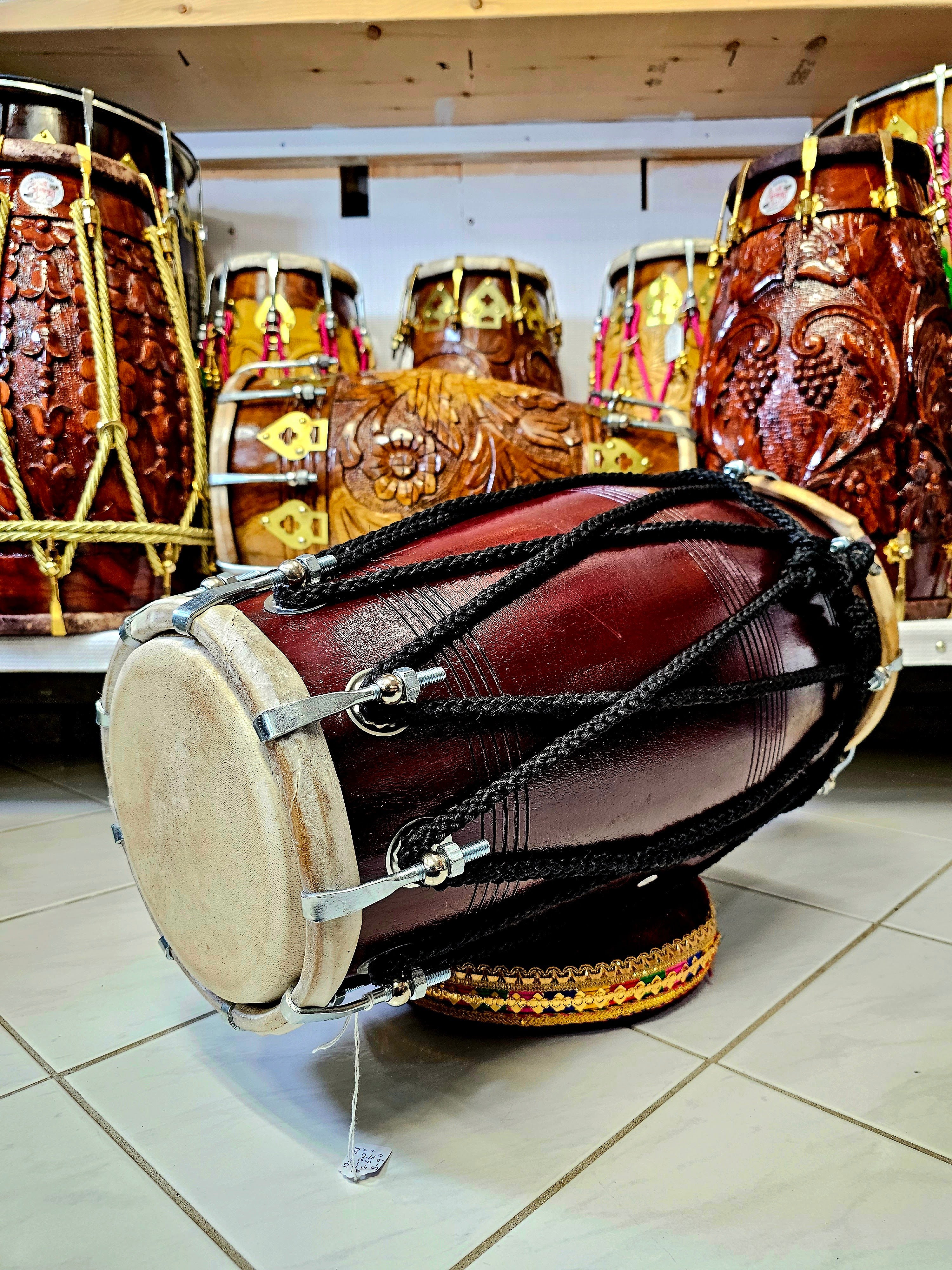 The Burgundy Premier Pro Dholak - A Professional Mango Wood Dholak with Black Ropes and Chrome Bolts!