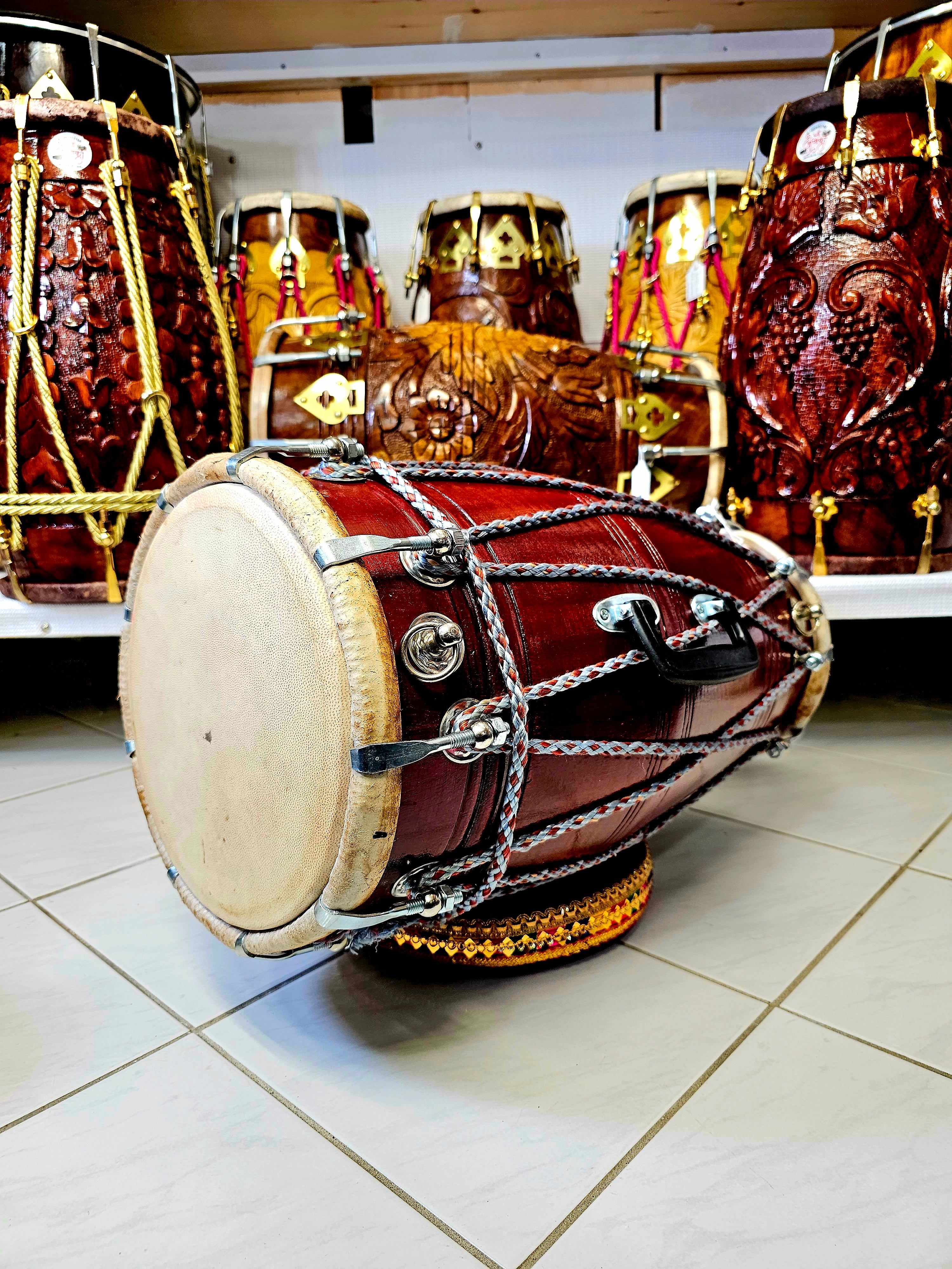 The Maroon Melody Master Dholak - A Professional Mango Wood Dholak with Elegant Maroon and Grey Rope Design and Chrome Bolts!