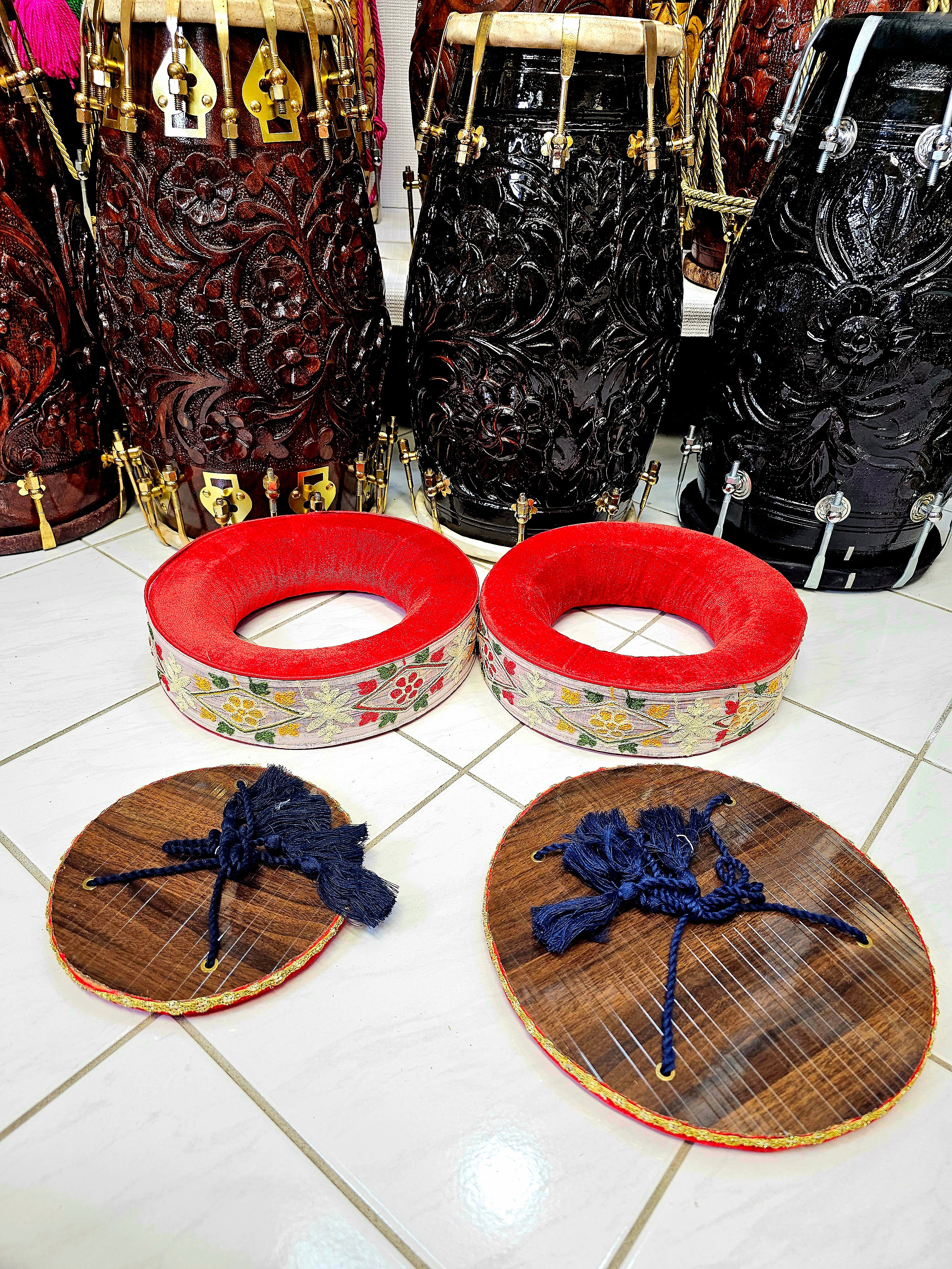 Artisanal Elegance: Premium Red Tabla Rings with Handcrafted Red, White, and Green Sewn Floral Design