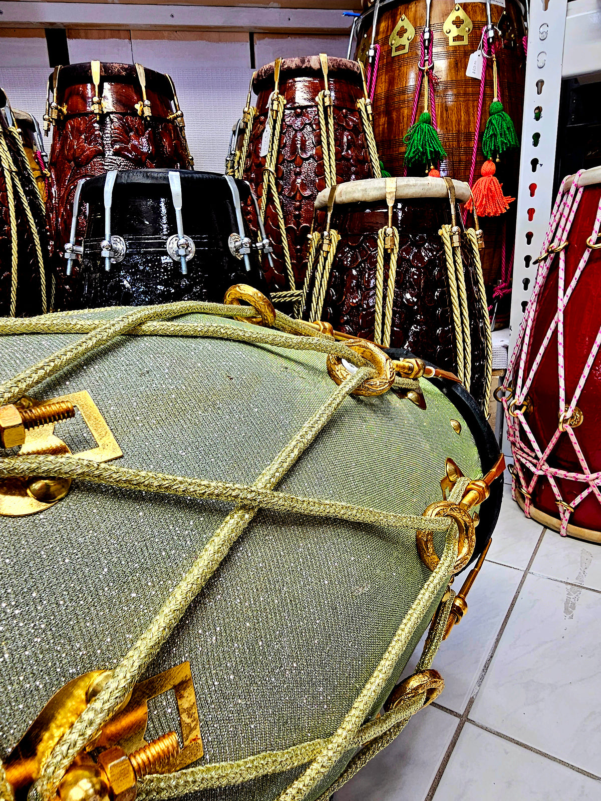 Radiant Rhythms: Sparkly Sherwani Wrapped Red Sheesham Dholak with Golden Brass Bolts and Black Pudis (Minor Fabric Rip Defects)