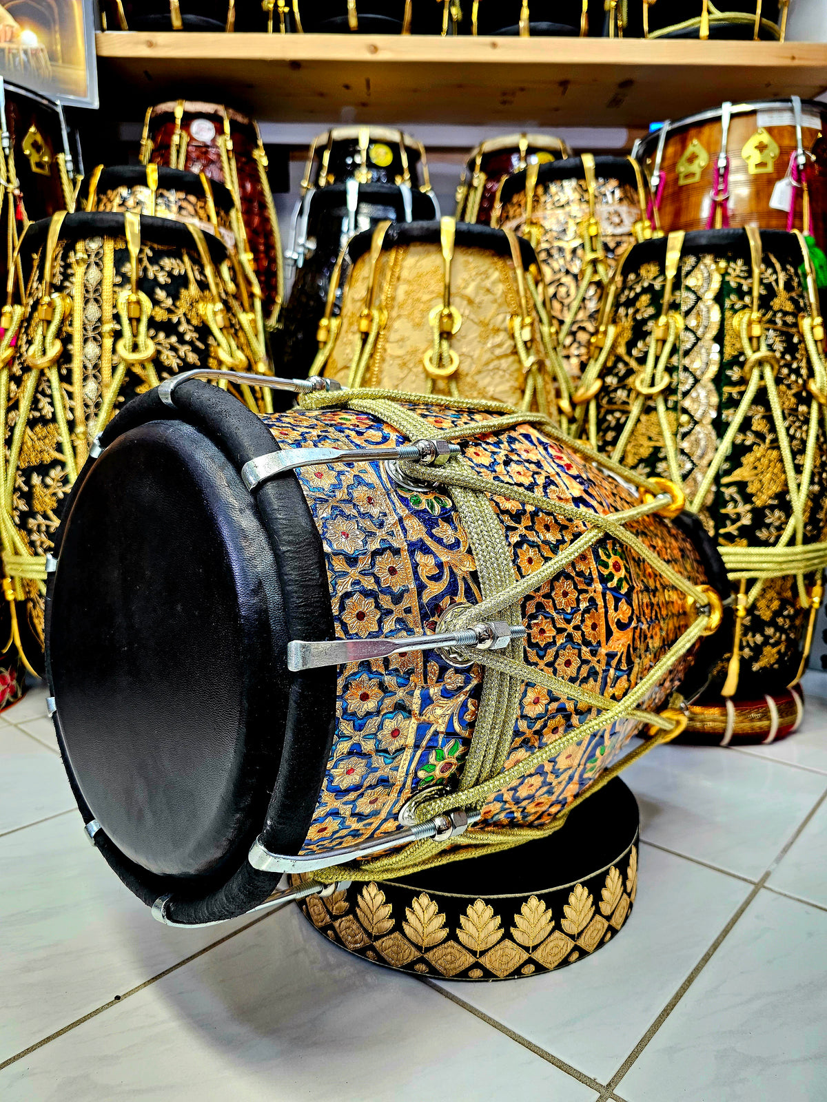 Harmony in Hues: Blue and Gold Designer Wrapped Red Sheesham Dholak with Black Skins and Chrome Bolts