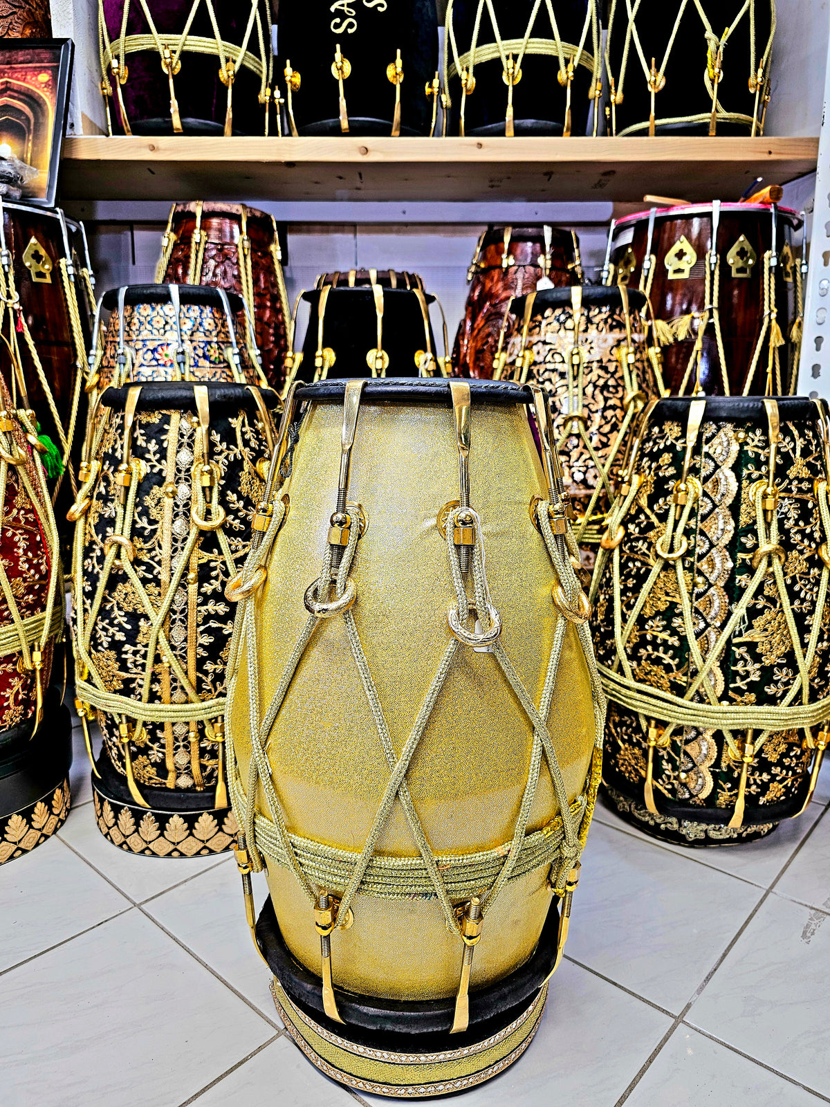 Radiant Rhythms: Golden Sparkly Wrapped Red Sheesham Dholak with Black Skins, Thin-Rimmed Treble Skin, and Golden Accents - *Slightly Imperfect Wrap