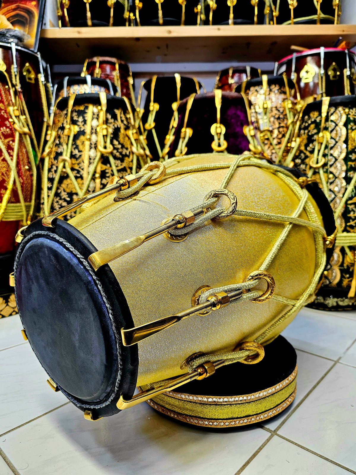 Radiant Rhythms: Golden Sparkly Wrapped Red Sheesham Dholak with Black Skins, Thin-Rimmed Treble Skin, and Golden Accents - *Slightly Imperfect Wrap