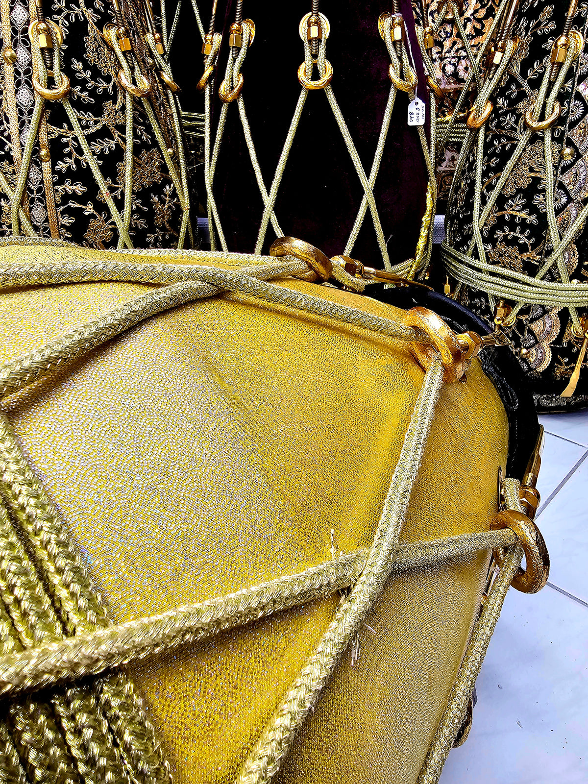Radiant Rhythms: Golden Sparkly Wrapped Red Sheesham Dholak with Black Skins, Thin-Rimmed Treble Skin, and Golden Accents - *Slightly Imperfect Wrap