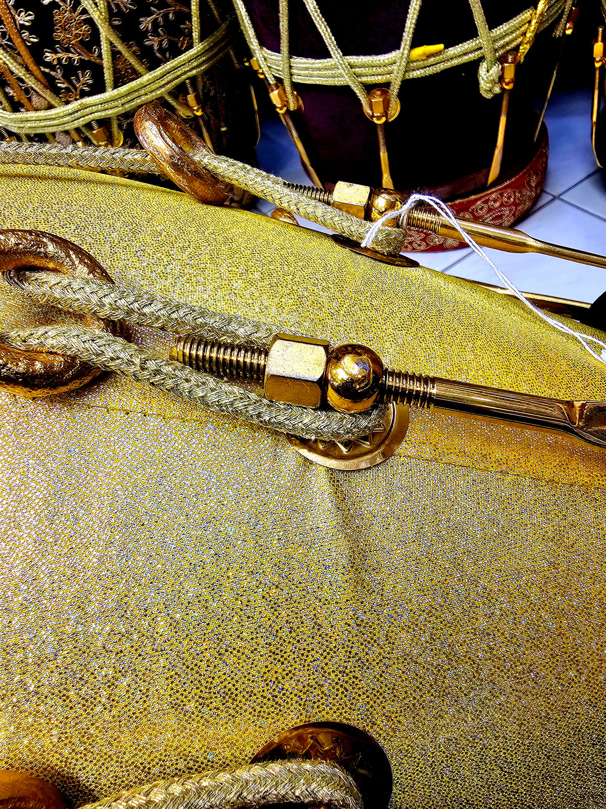 Radiant Rhythms: Golden Sparkly Wrapped Red Sheesham Dholak with Black Skins, Thin-Rimmed Treble Skin, and Golden Accents - *Slightly Imperfect Wrap