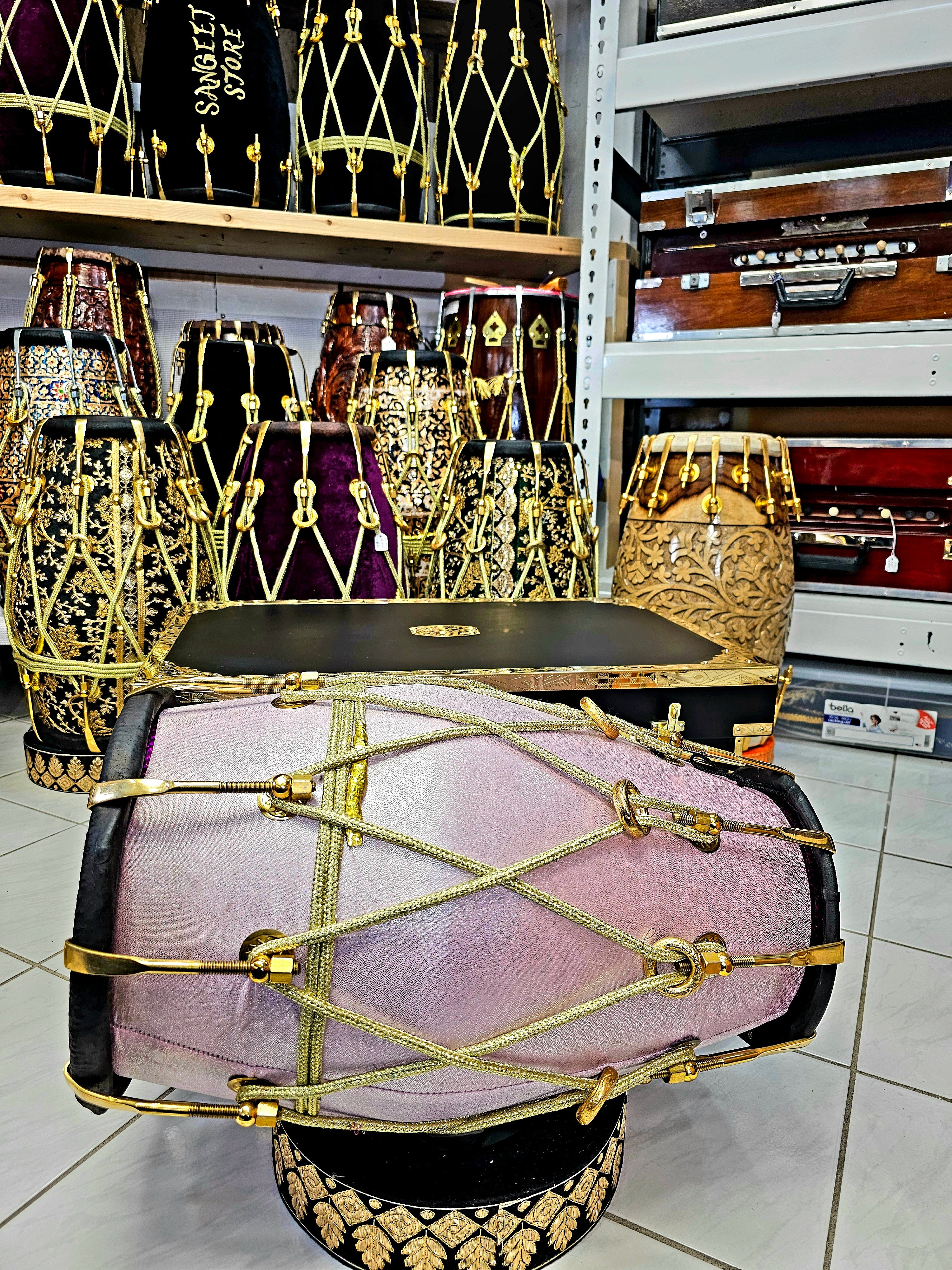 Enchanting Blush Sparkle: Red Sheesham Dholak in Sparkly Pink Wrap, Black Skins, Golden Brass Accents, and Intricate Golden Ropes
