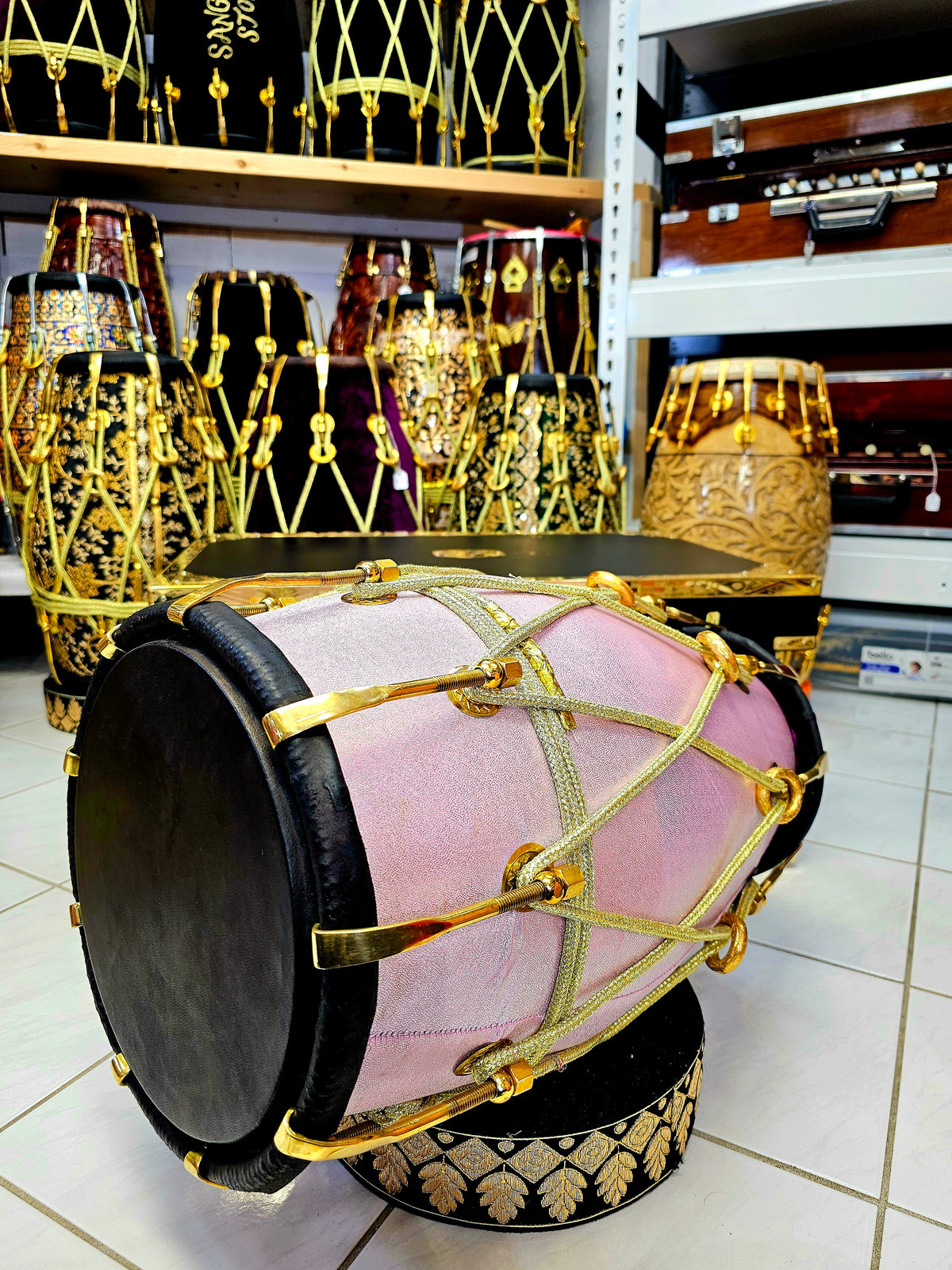 Enchanting Blush Sparkle: Red Sheesham Dholak in Sparkly Pink Wrap, Black Skins, Golden Brass Accents, and Intricate Golden Ropes