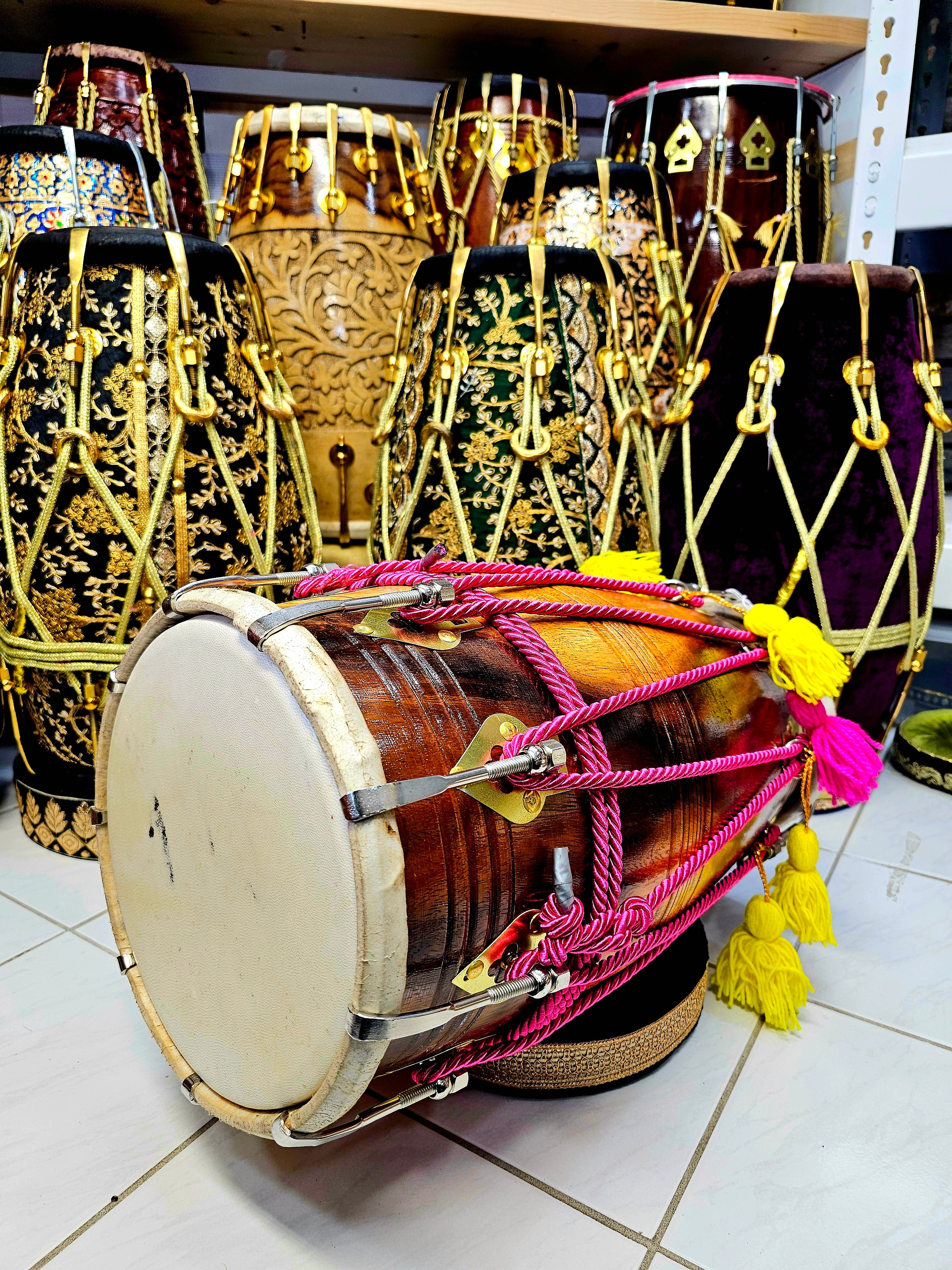 Vibrant Harmony: Glossy 2-Tone Red Sheesham Dholak with Chrome Bolts, Pink Ropes Design, and Playful Pink & Yellow Tassels