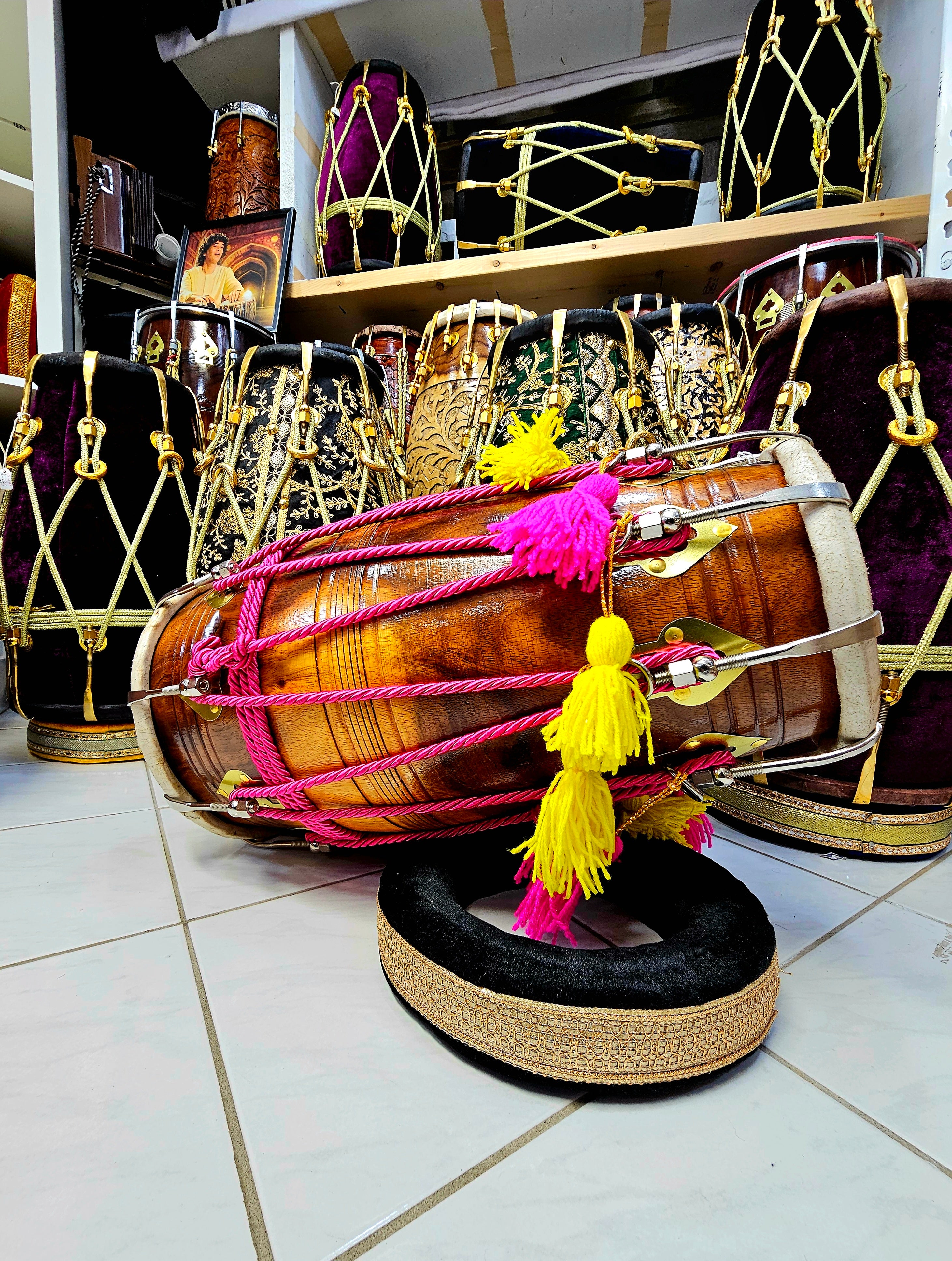 Vibrant Harmony: Glossy 2-Tone Red Sheesham Dholak with Chrome Bolts, Pink Ropes Design, and Playful Pink & Yellow Tassels
