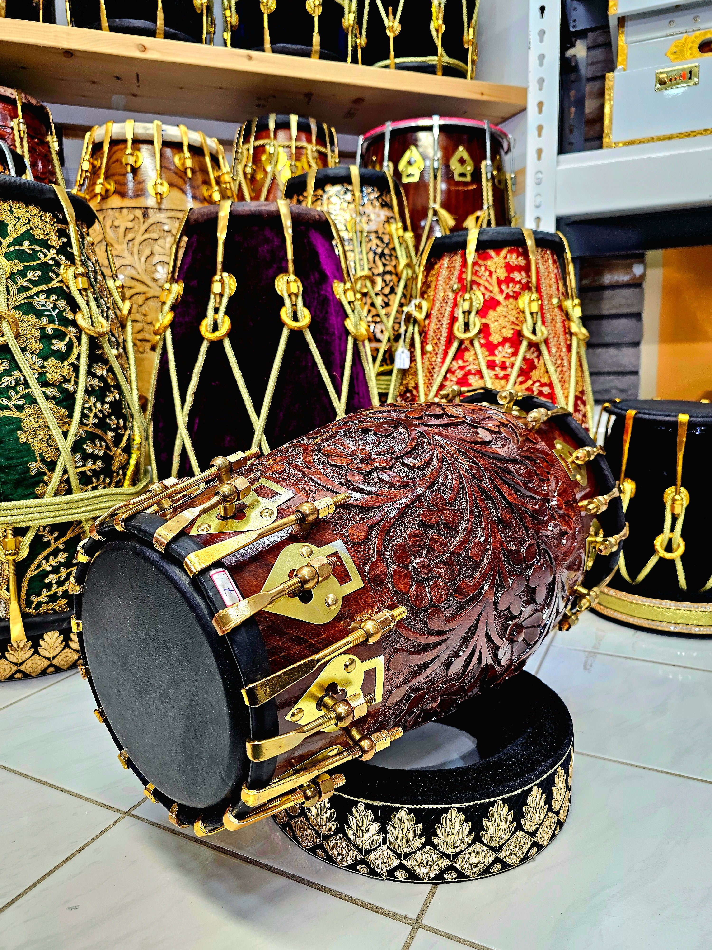 Prem's Florid Echo: Custom Floral Engraved Black Sheesham Dholak with Brass Bolts and Ebony Black Skin (Includes 2 Extra Concert Quality Skins ($50 Each))