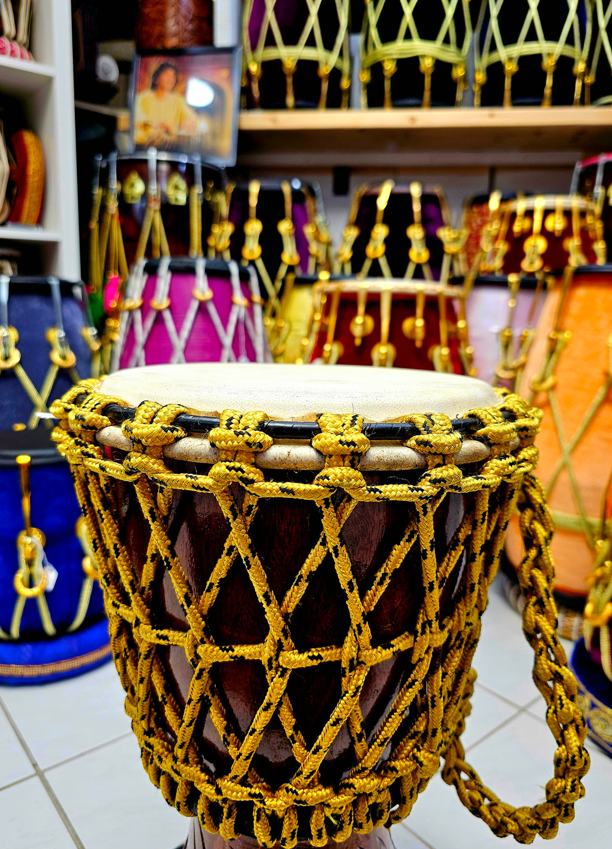 Sunset Serenity: Compact Engraved Red Sheesham Djembe with Yellow Ropes and Black Accents