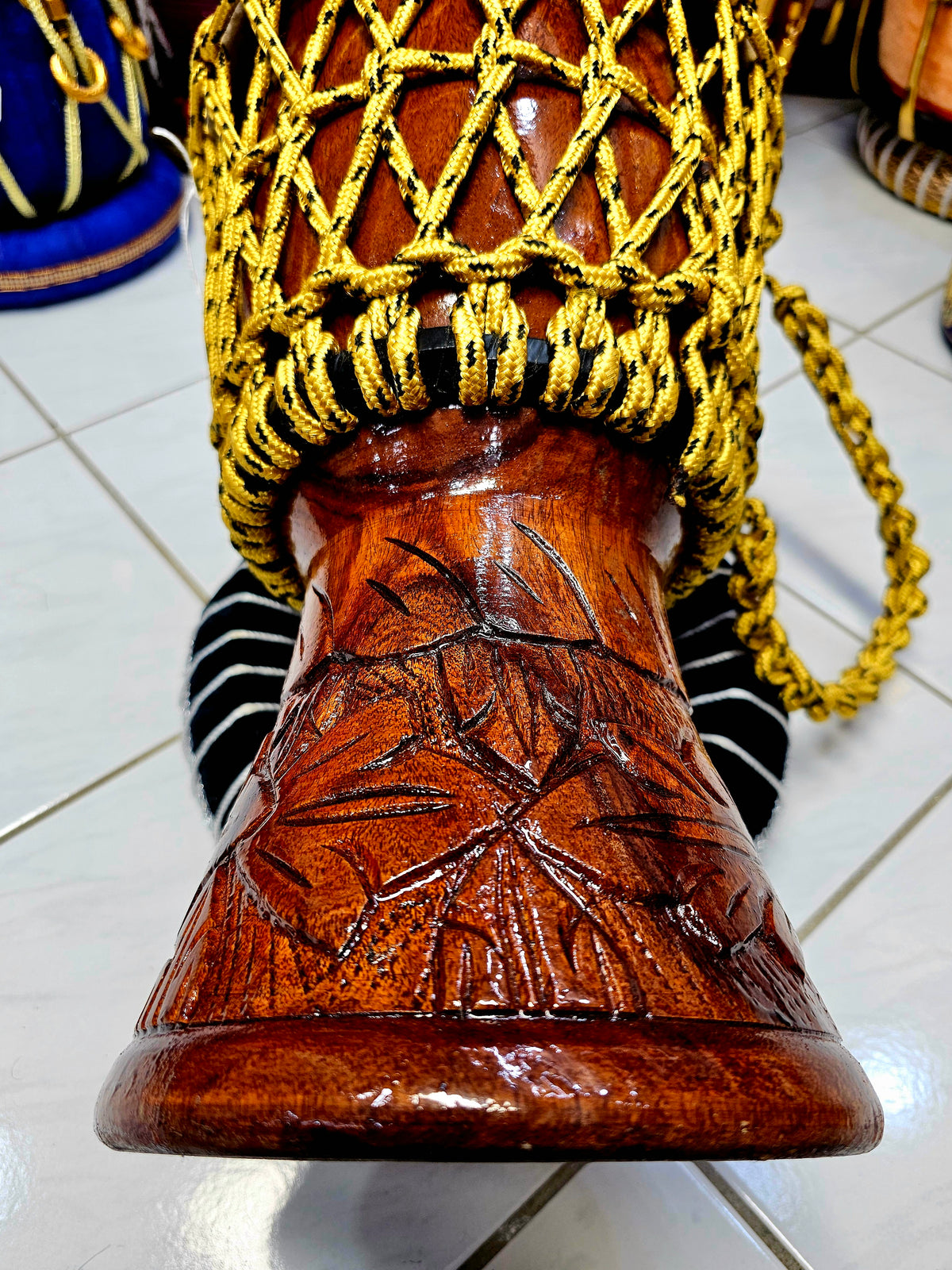 Sunset Serenity: Compact Engraved Red Sheesham Djembe with Yellow Ropes and Black Accents