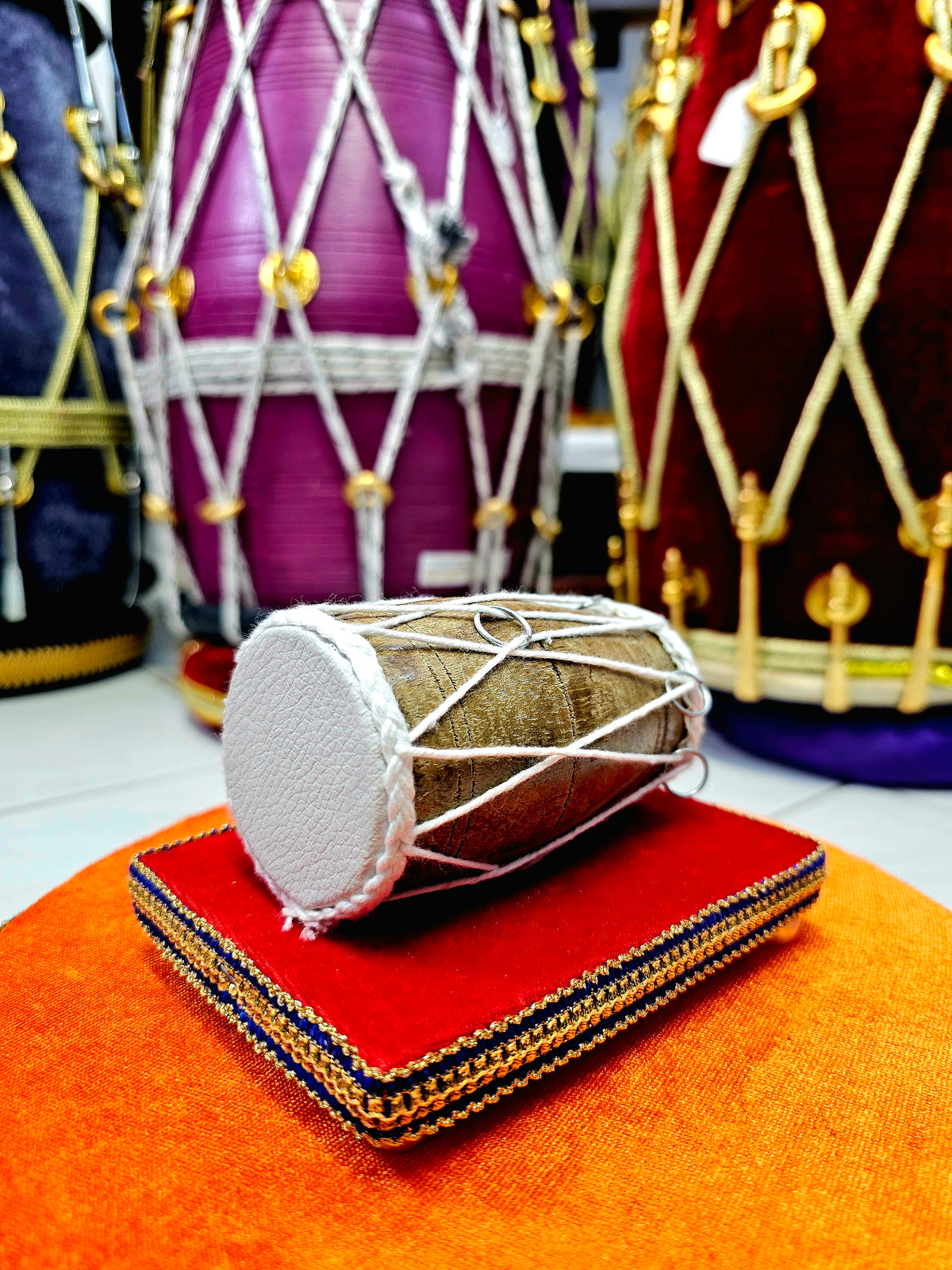 Crimson Cadence: Mini Decorative Dholak Display (Red Base)