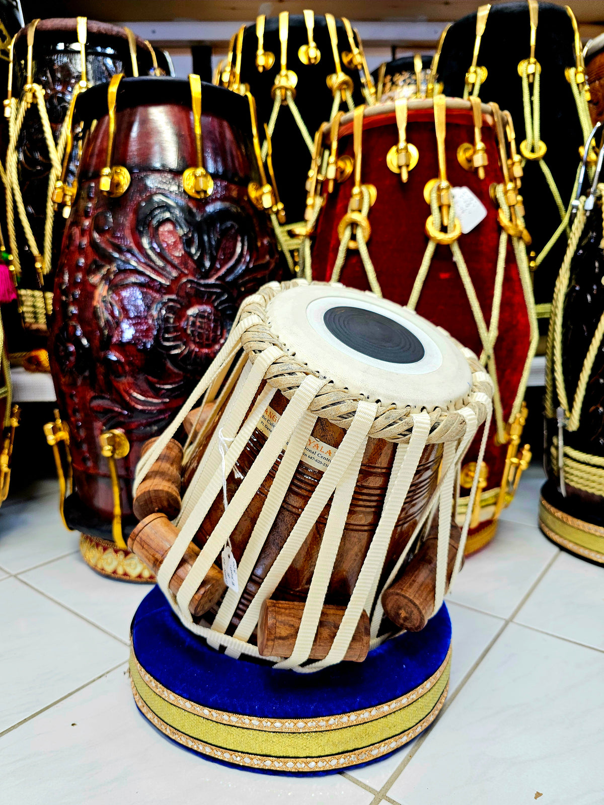 Krishna's Resonant Legacy: 5.5" D#/E Red Sheesham Nylon Strapped Sandeep Ghosh Dayan + Sonic Brilliance Tabla Set + Nautical Rhythm Professional Navy Blue Bolted Dholak