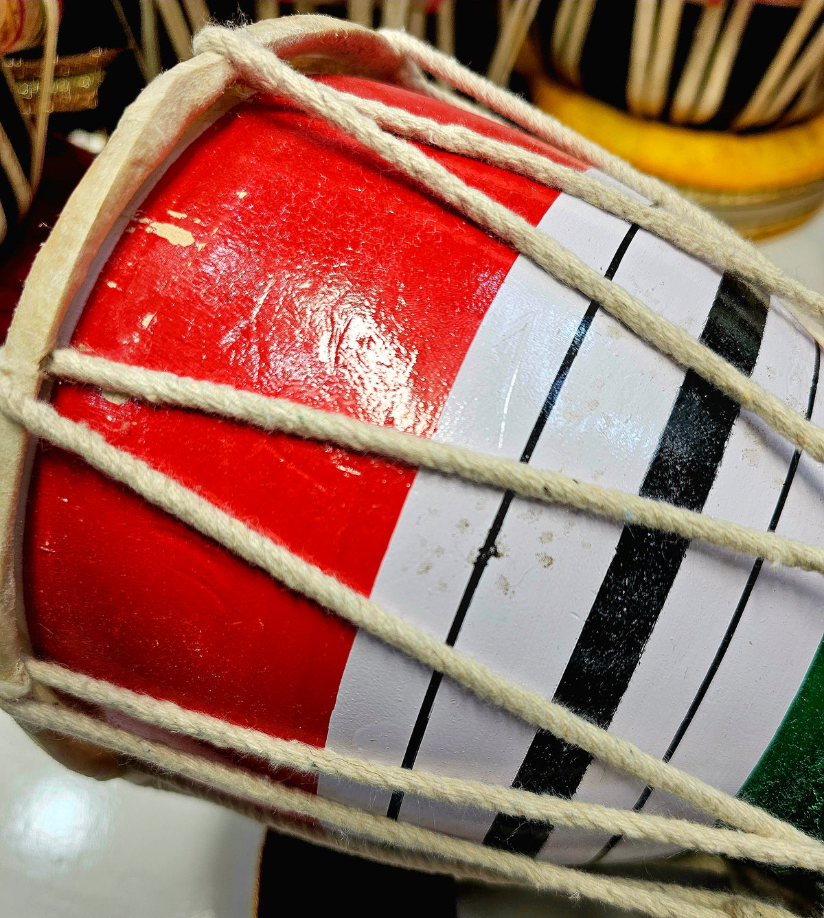 Trinity Rhythm Damru: Red, White, Black with Vibrant Green Core - Sangeet Store