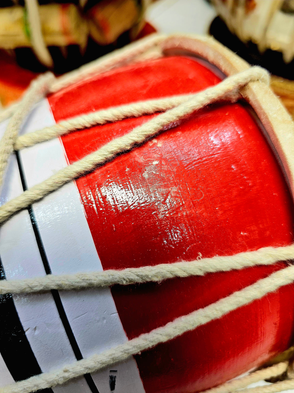 Trinity Rhythm Damru: Red, White, Black with Vibrant Green Core - Sangeet Store