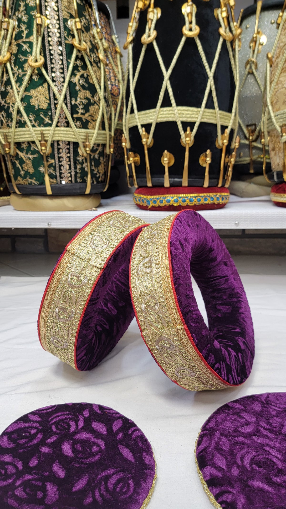 Imperial Amethyst: Purple Tabla Rings Set with Elaborate Golden Design