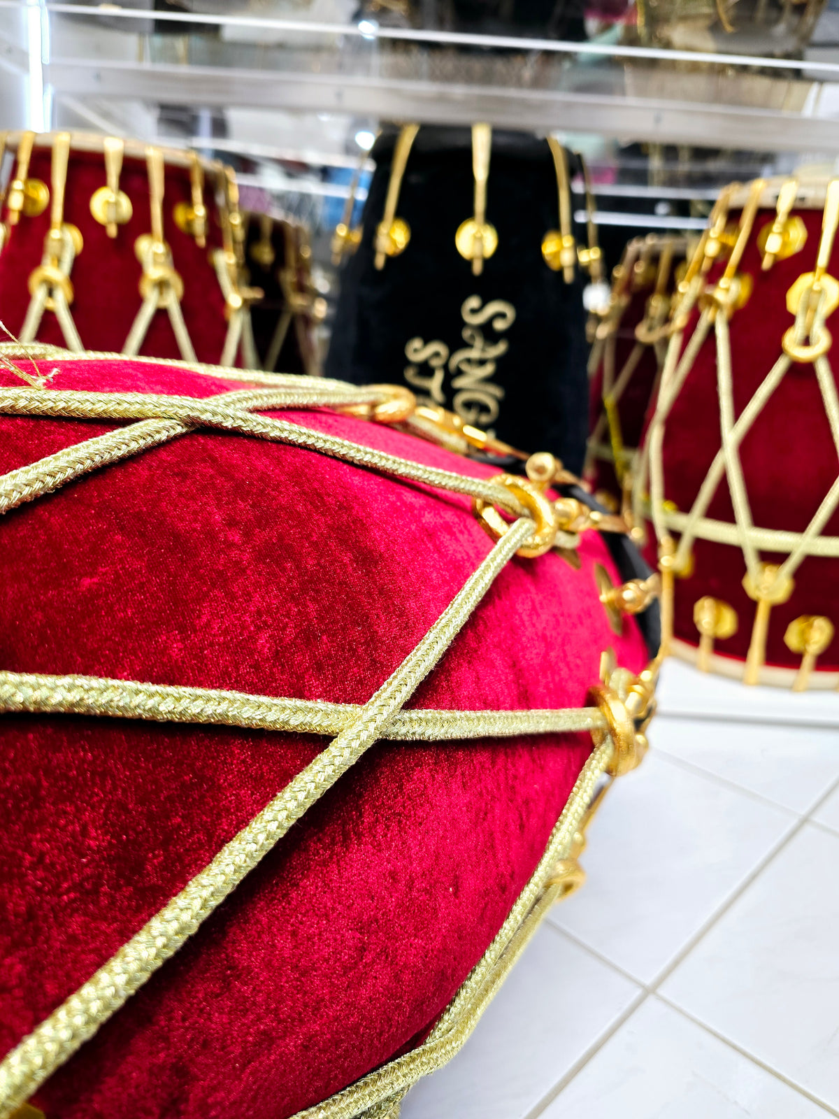 Velvet Ember Dholak: Red Sheesham with Black Skins & Golden Brass Double Bolts