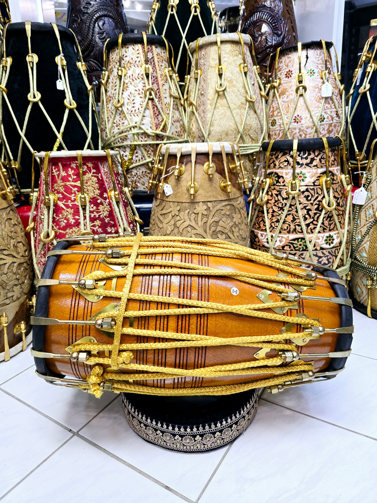 Golden Echo: Traditional Red Sheesham Professional Double Bolted Dholak with Golden Coated Brass Bolts, Black Skins, and Yellow Ropes Design
