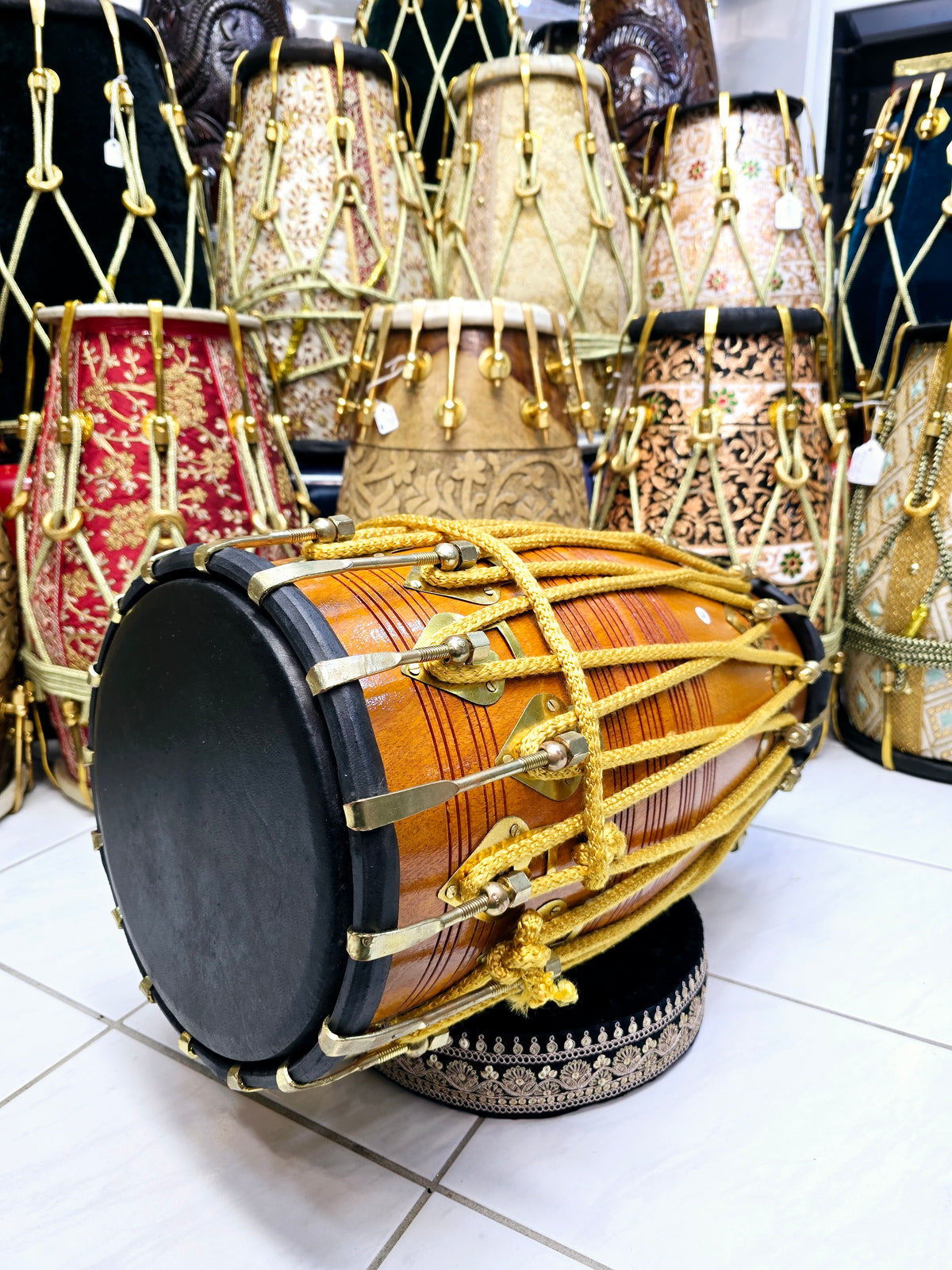 Golden Echo: Traditional Red Sheesham Professional Double Bolted Dholak with Golden Coated Brass Bolts, Black Skins, and Yellow Ropes Design
