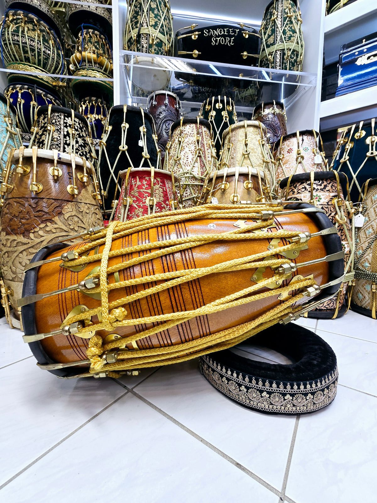 Golden Echo: Traditional Red Sheesham Professional Double Bolted Dholak with Golden Coated Brass Bolts, Black Skins, and Yellow Ropes Design
