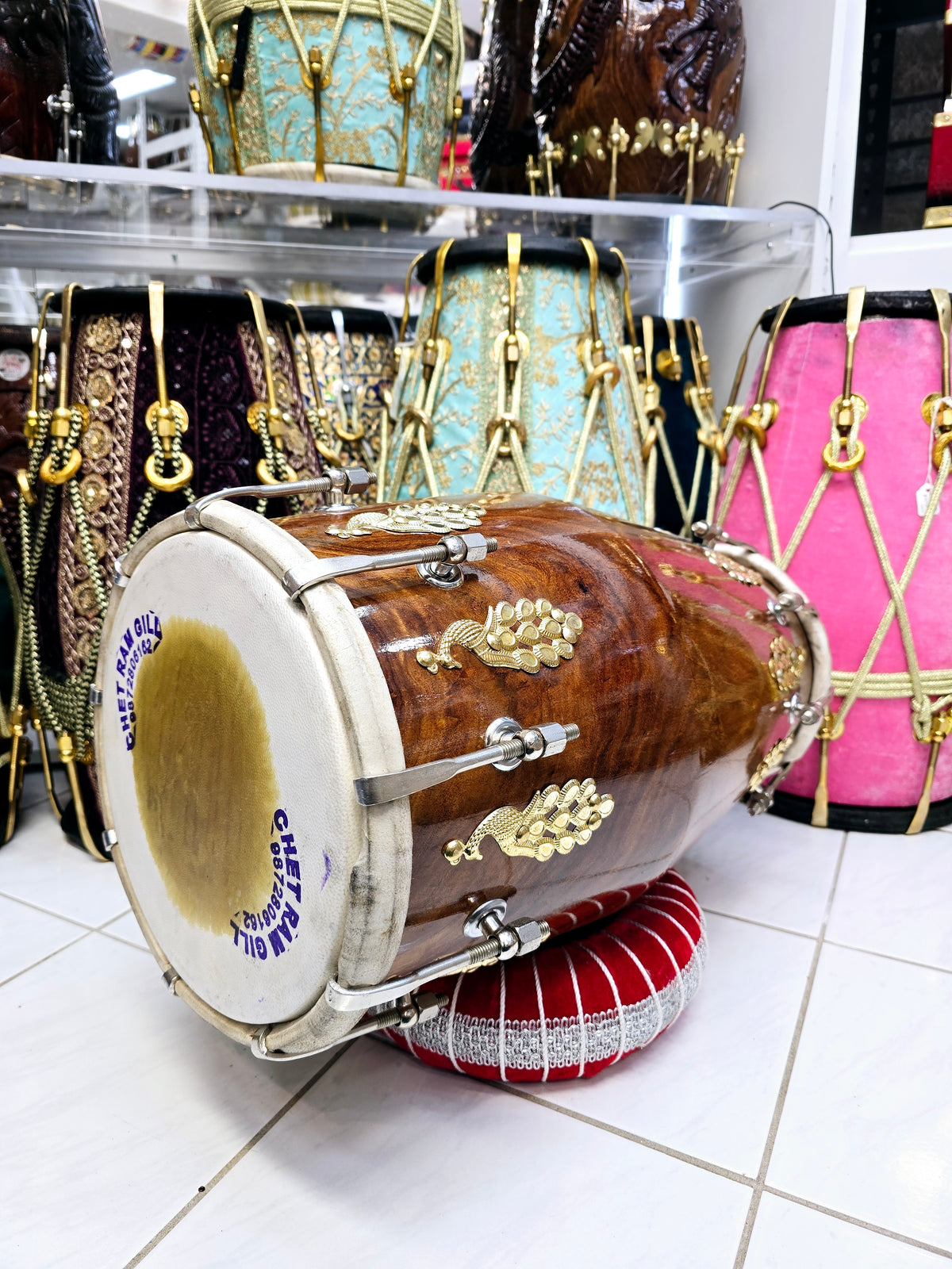 Mayurdhwani™ by Chetram Gill | Red Sheesham Dholak, 16 lbs with Gloss Finish, Golden Peacock Accent & Chrome Bolts