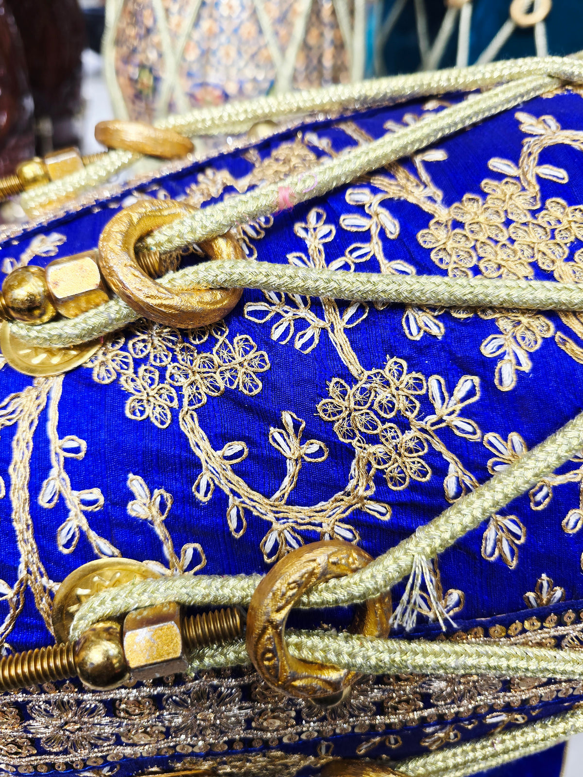 Royal Heritage: Blue and Gold Sherwani Wrapped Red Sheesham Dholak with Reverse Syaahi Thin Rimmed Skin and Black Skins *Minor Cosmetic Defects *Exceptional Tone