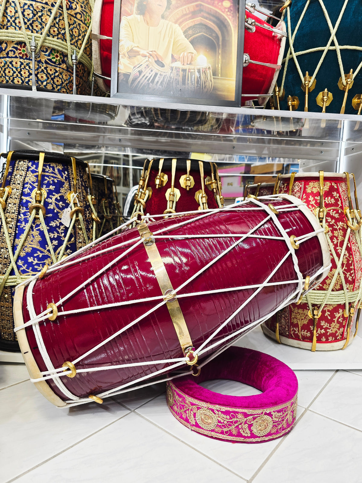 Crimson Relay – West Indian Dholak
23.25″ Length | 17.2 lbs Solid Red Sheesham | *Exceptional Tone *Minor Cosmetic Blemishes