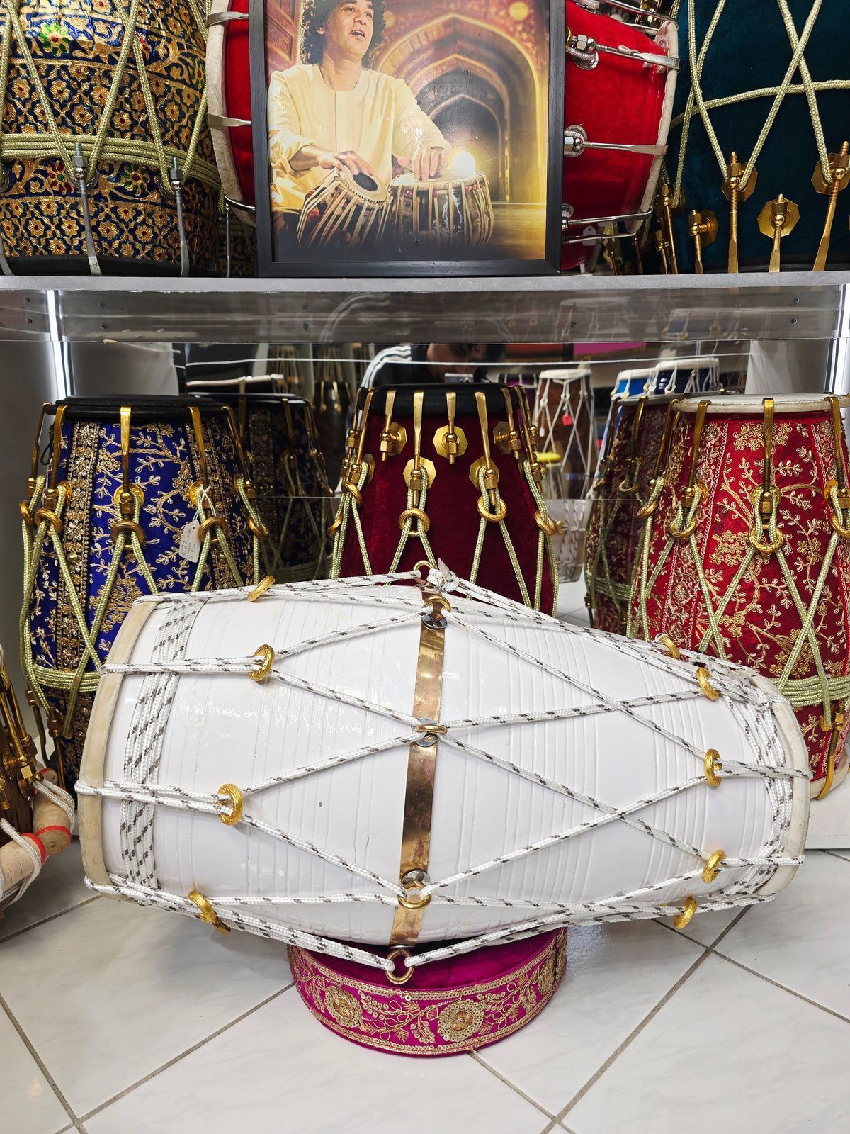 Ivory Current – West Indian Dholak
22.5″ Length | 14.4 lbs Red Sheesham | Exceptional Tone • Minor Cosmetic Blemishes